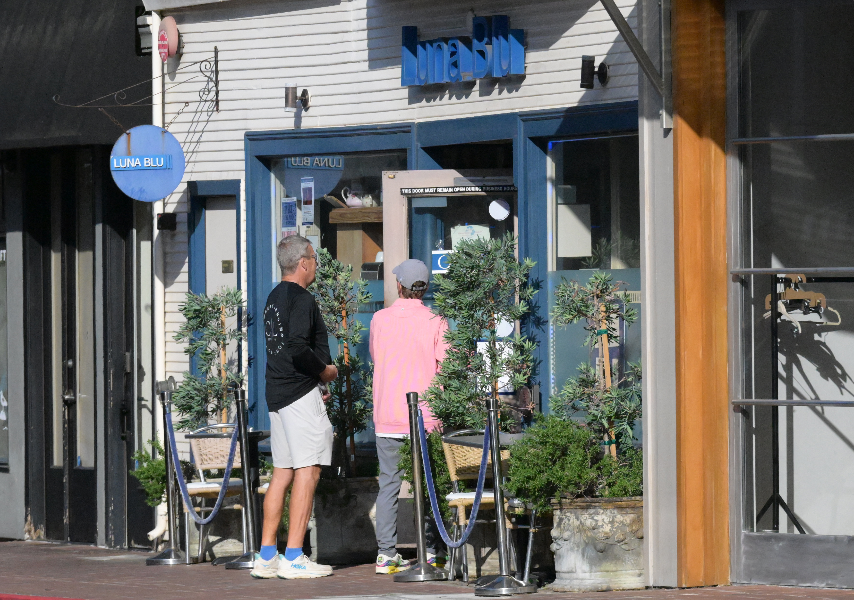 Customers head into Luna Blu in Tiburon on May 29....