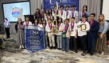 Students from McGarvin Intermediate School pose with medals and trophies during an awards ceremony at the 2026 United States Academic Pentathlon National Finals in Nashville, Tennessee.