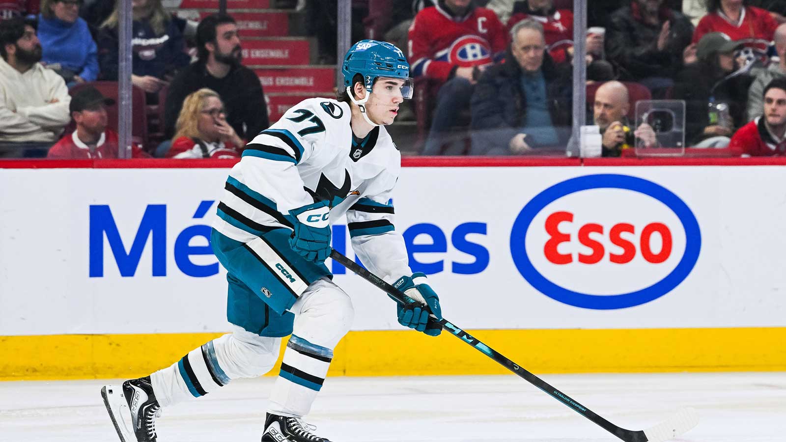 San Jose Sharks center Michael Misa (77) plays the puck against the Montreal Canadiens during the second period at Bell Centre. 