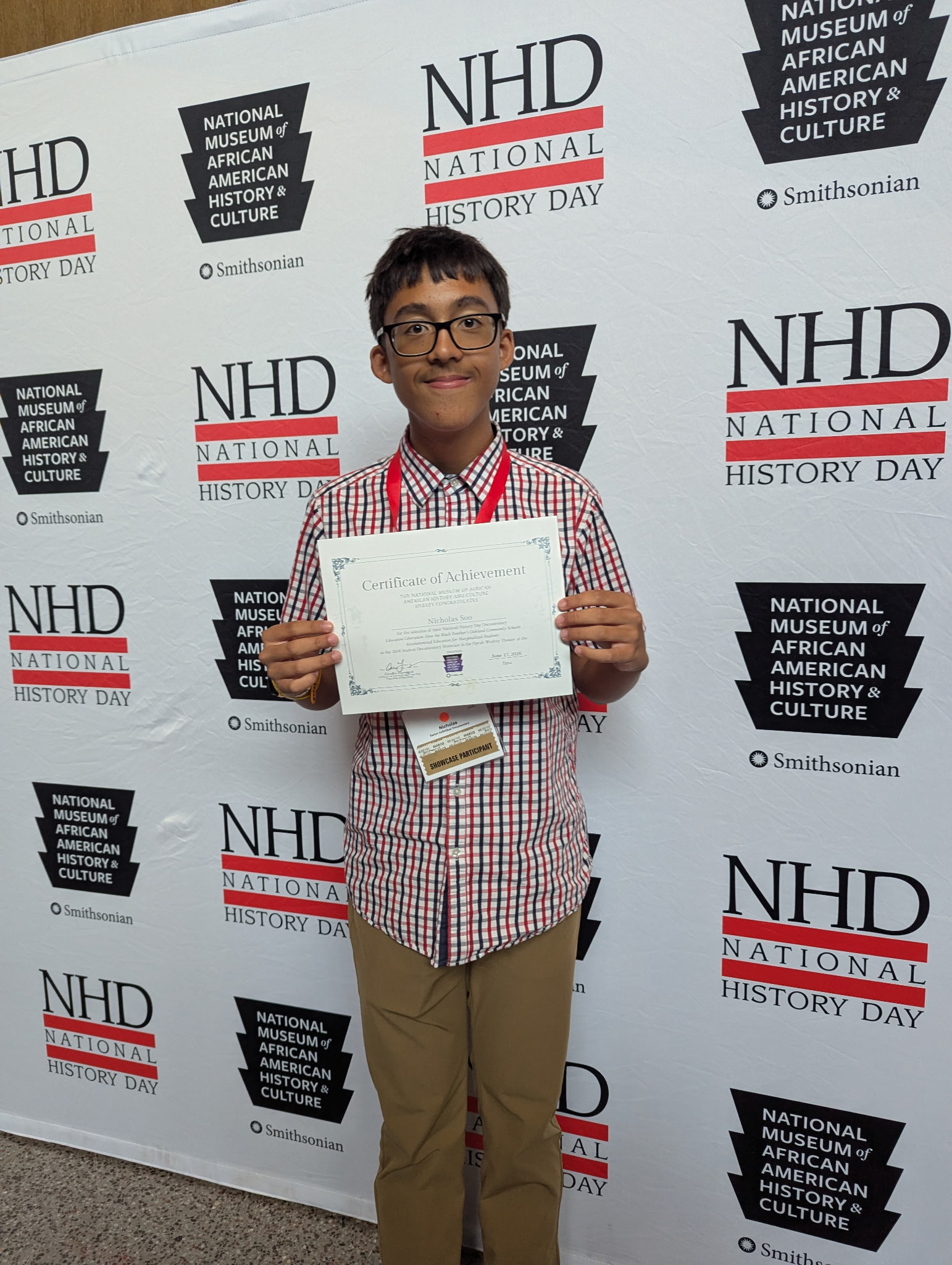 Irvine High School student Nicholas Soo poses with a certificate recognizing his selection for a documentary showcase at the Smithsonian’s National Museum of African American History and Culture during the 2026 National History Day National Contest.