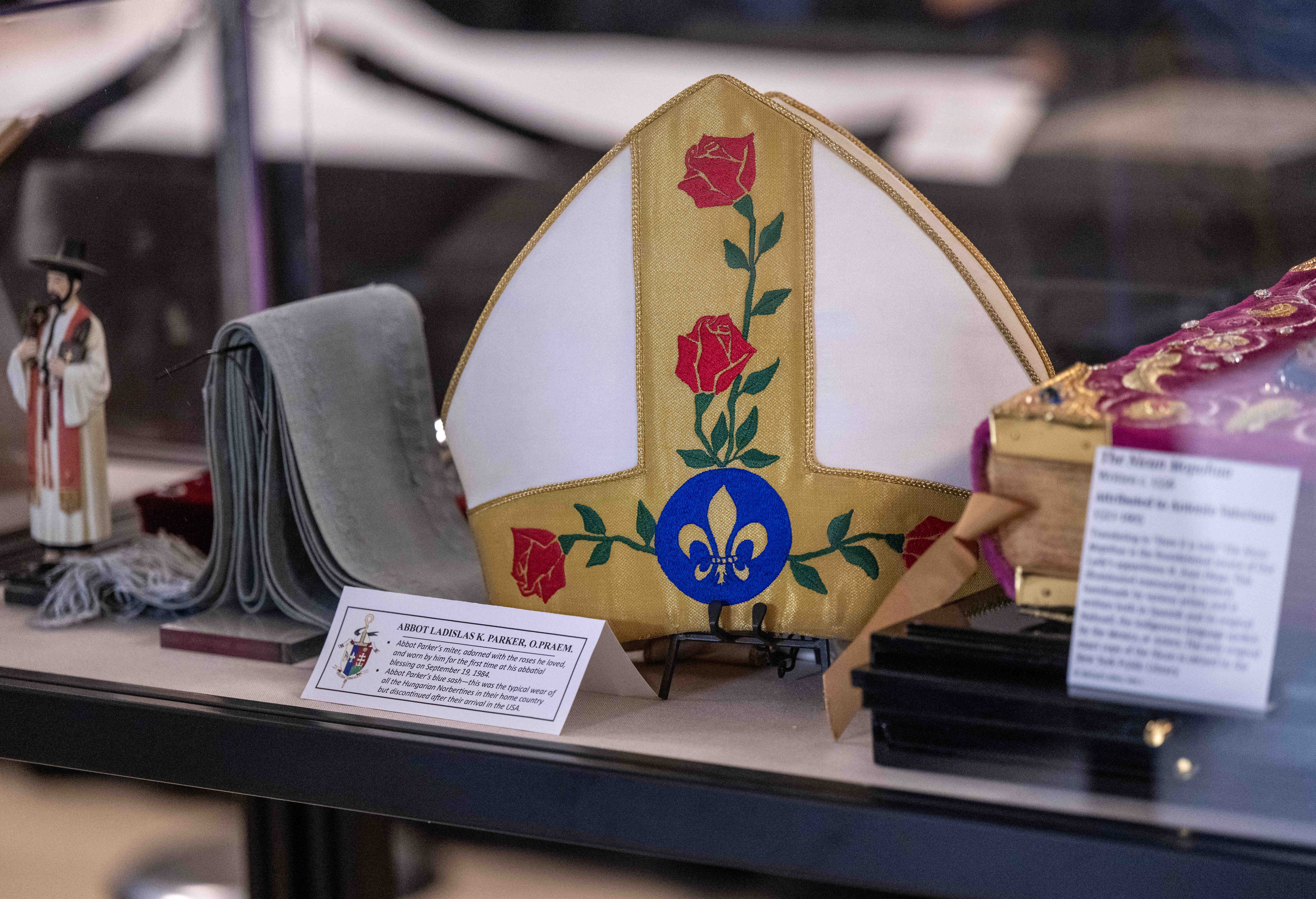 A ceremonial miter, or headdress, and sash, worn by Abbot...