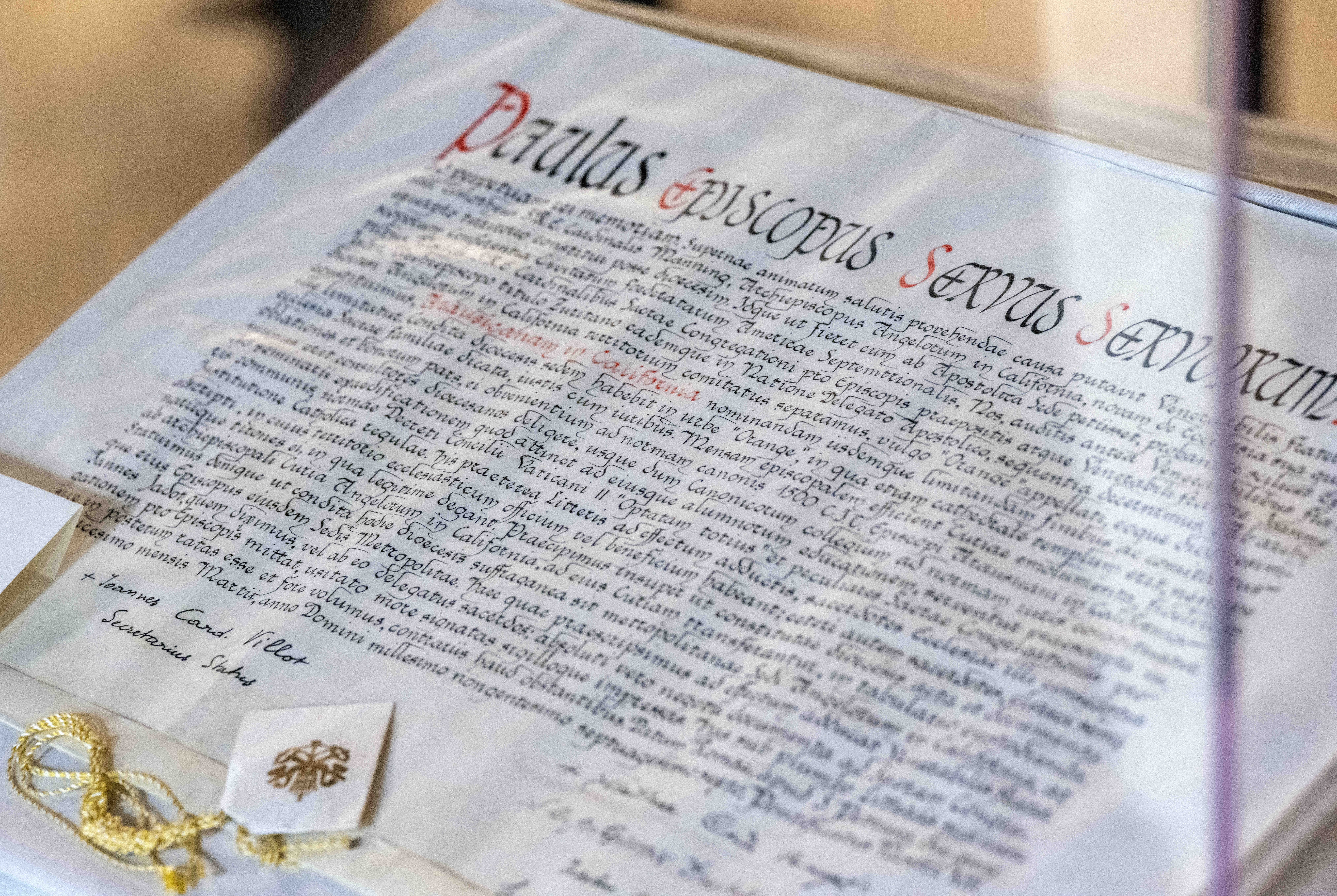 A hand-written Latin document from the Vatican in 1976, issued...
