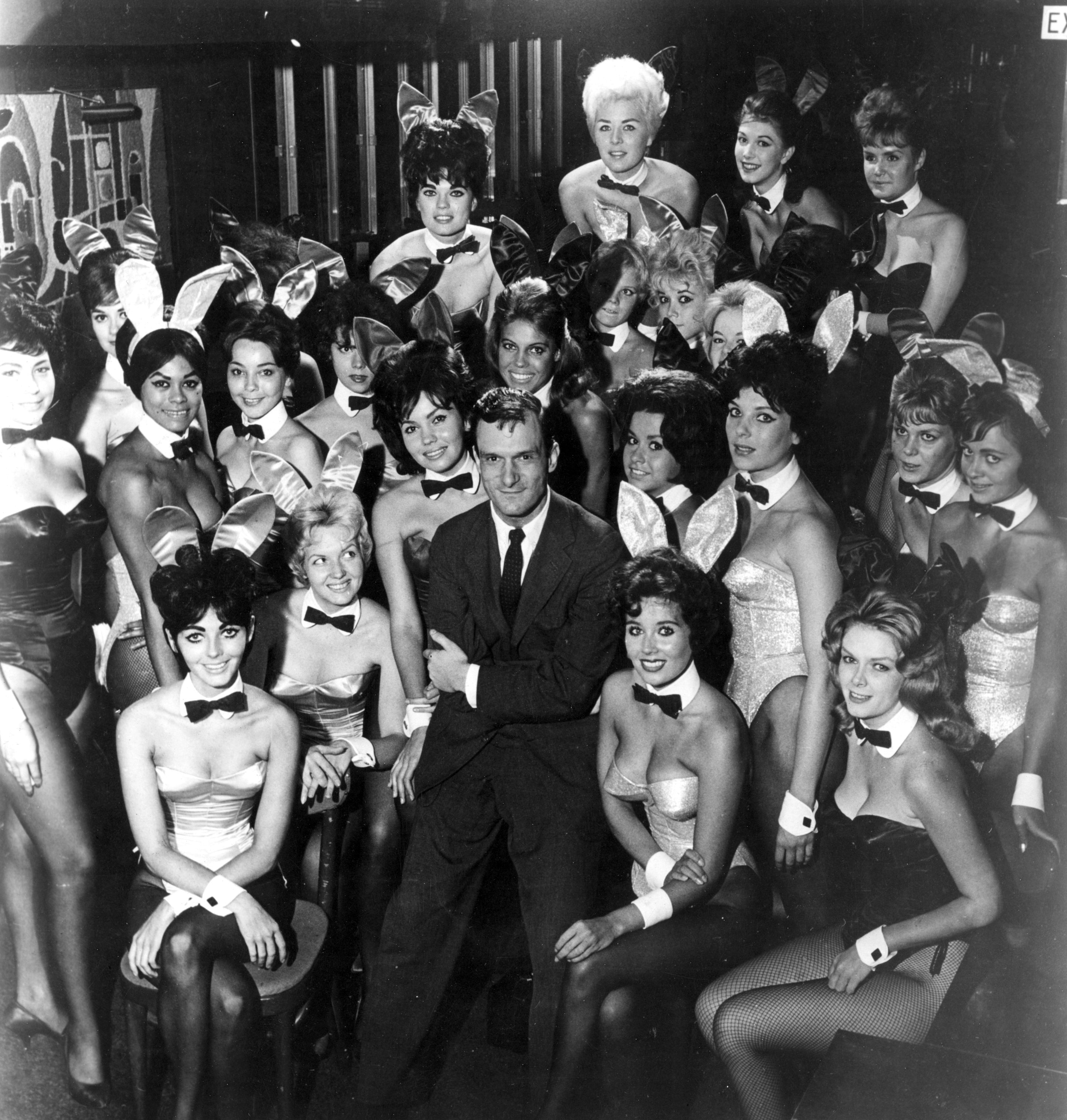 Playboy founder Hugh Hefner seen here in a group of...
