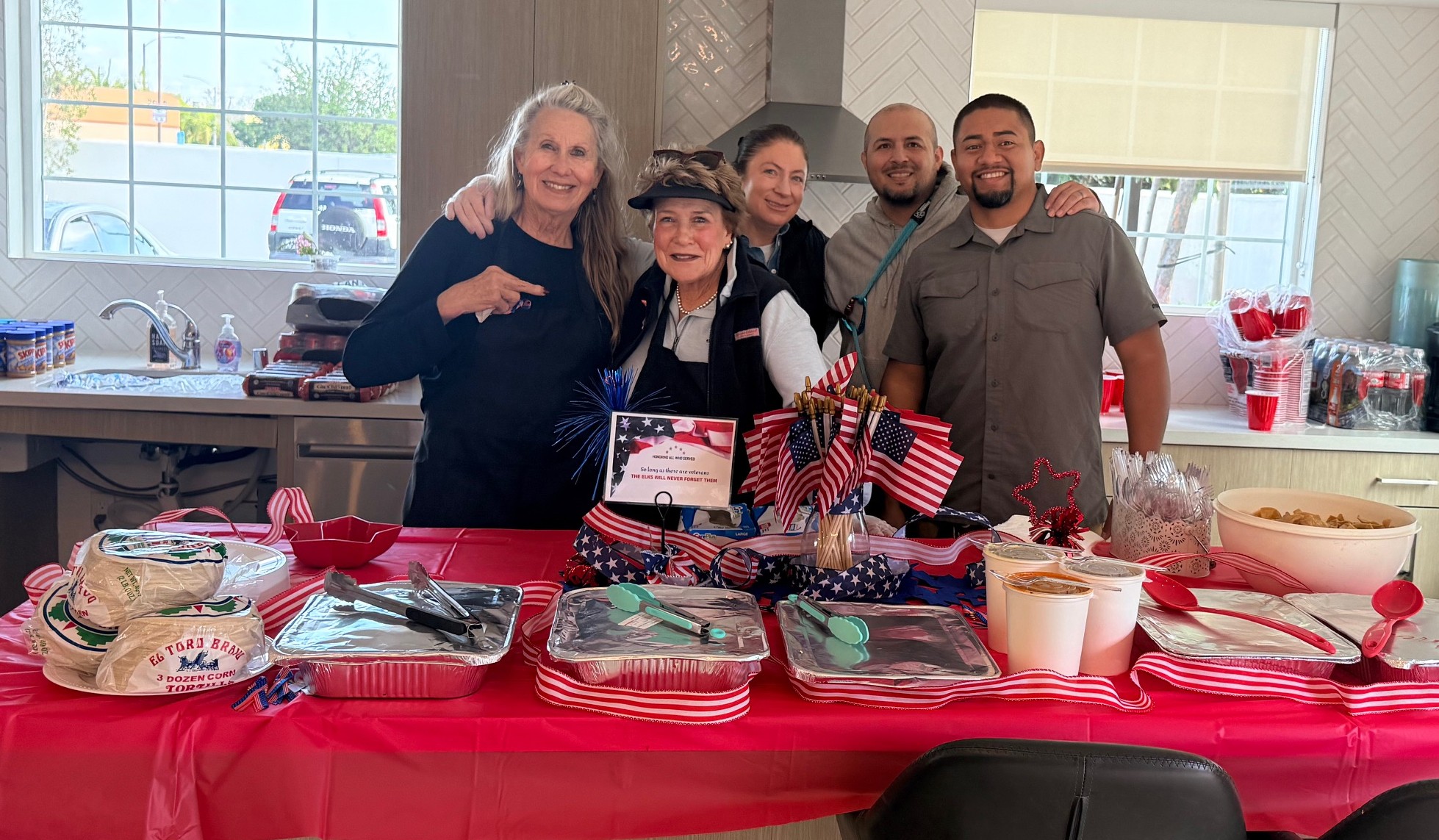 From left, Dale Vogel, Pam Atkins, Kara Demostene, and veterans...
