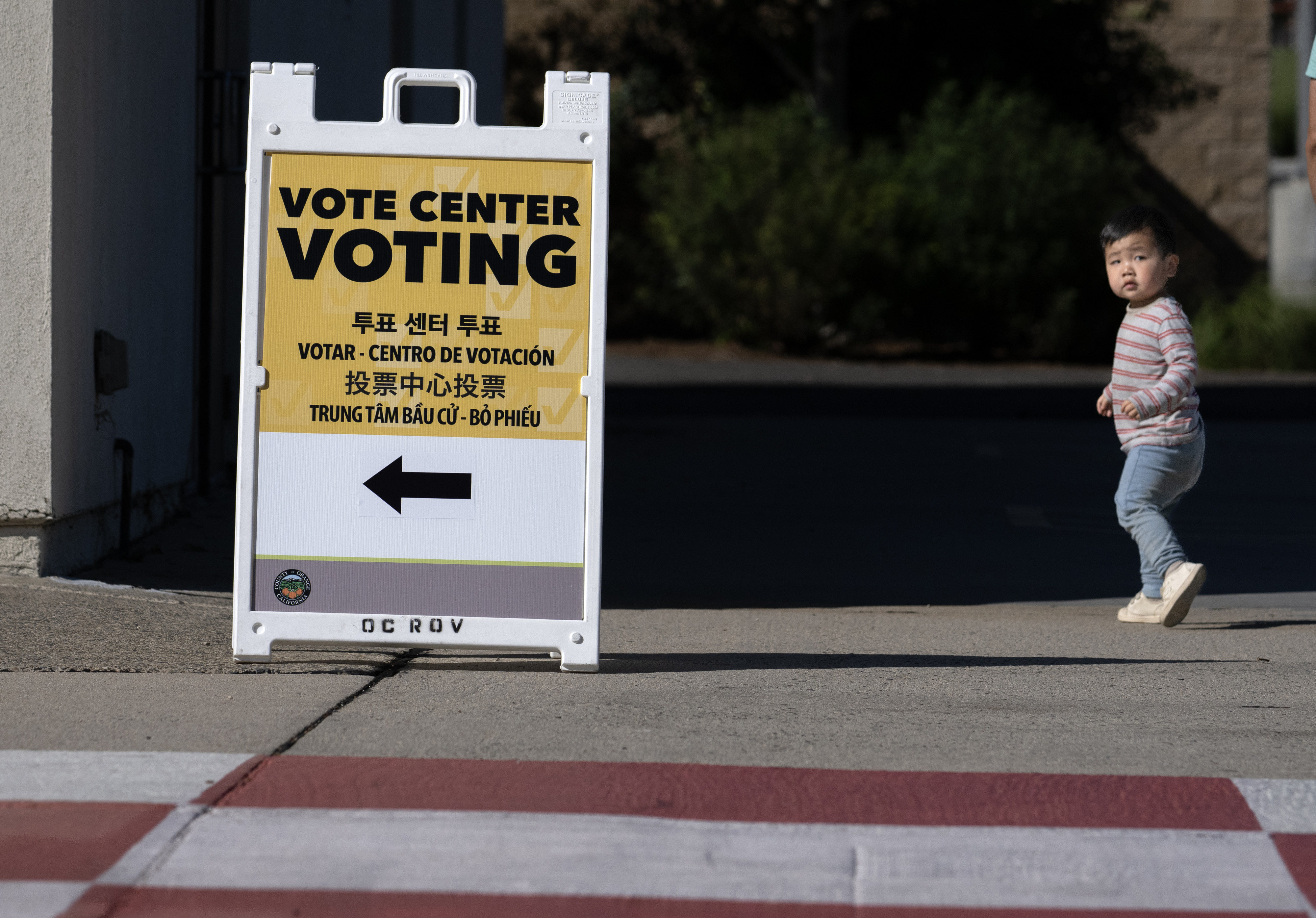 Voting center signs direct would-be voters to the polling place...