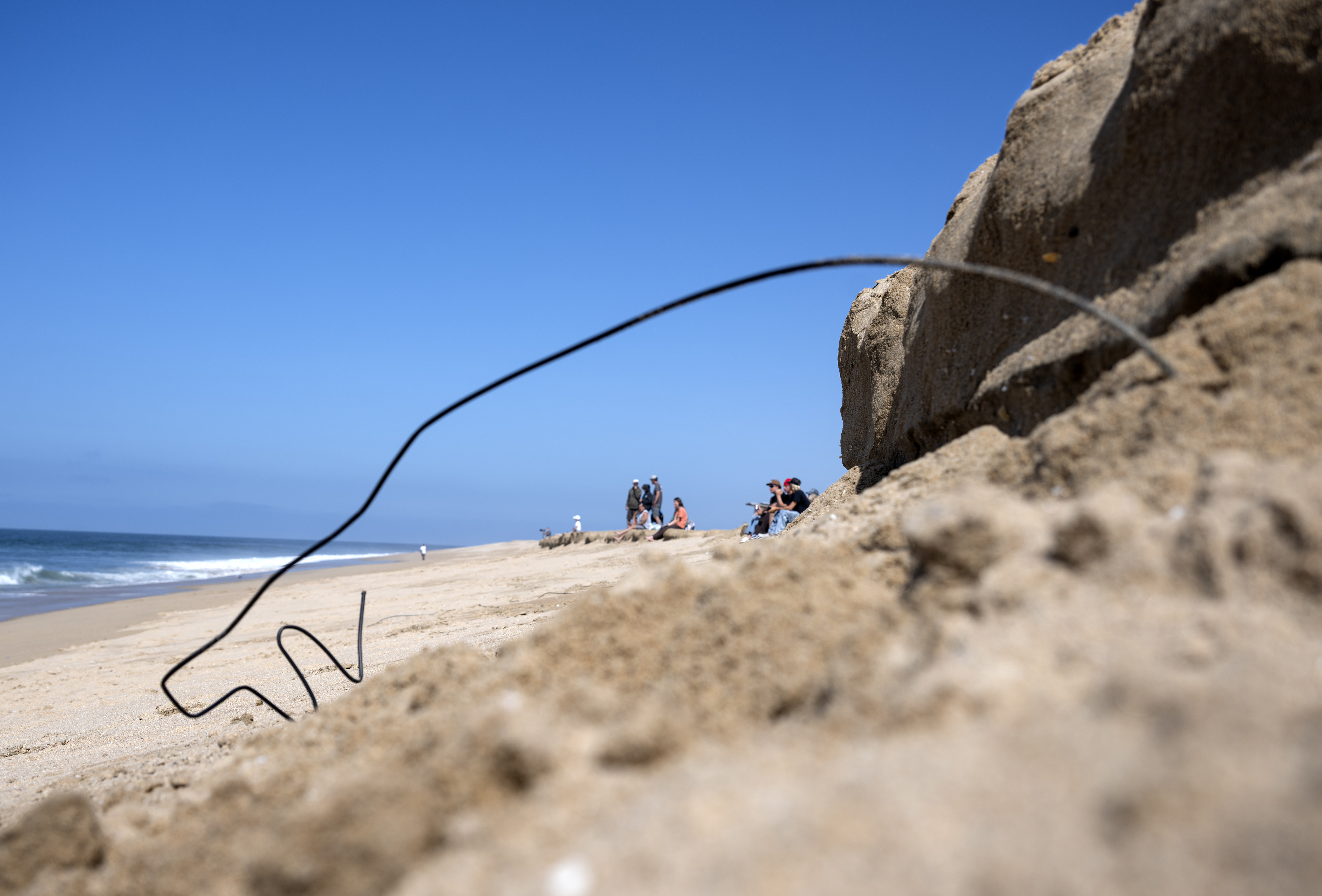 Old wires are revealed at the Wedge in Newport Beach...