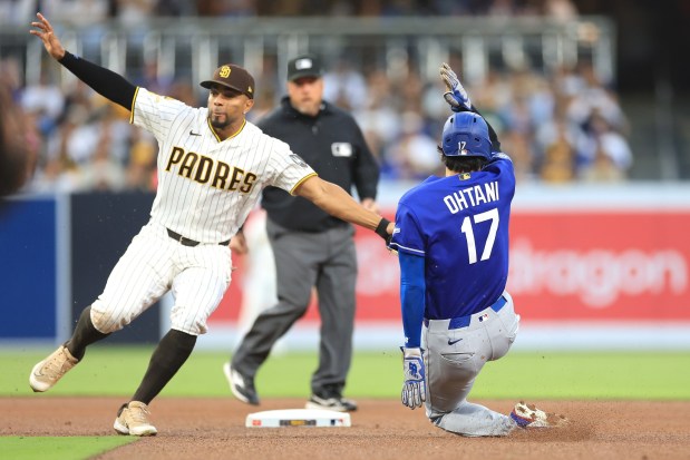 Shohei Ohtani #17 of the Los Angeles Dodgers is tagged out stealing second base by Xander Bogaerts #2 of the San Diego Padres during the fourth inning of a game at Petco Park on May 18, 2026, in San Diego, California. The two rival teams will face off at Dodger Stadium in Los Angeles on Saturday, July 4. (Photo by Sean M. Haffey, Getty Images)