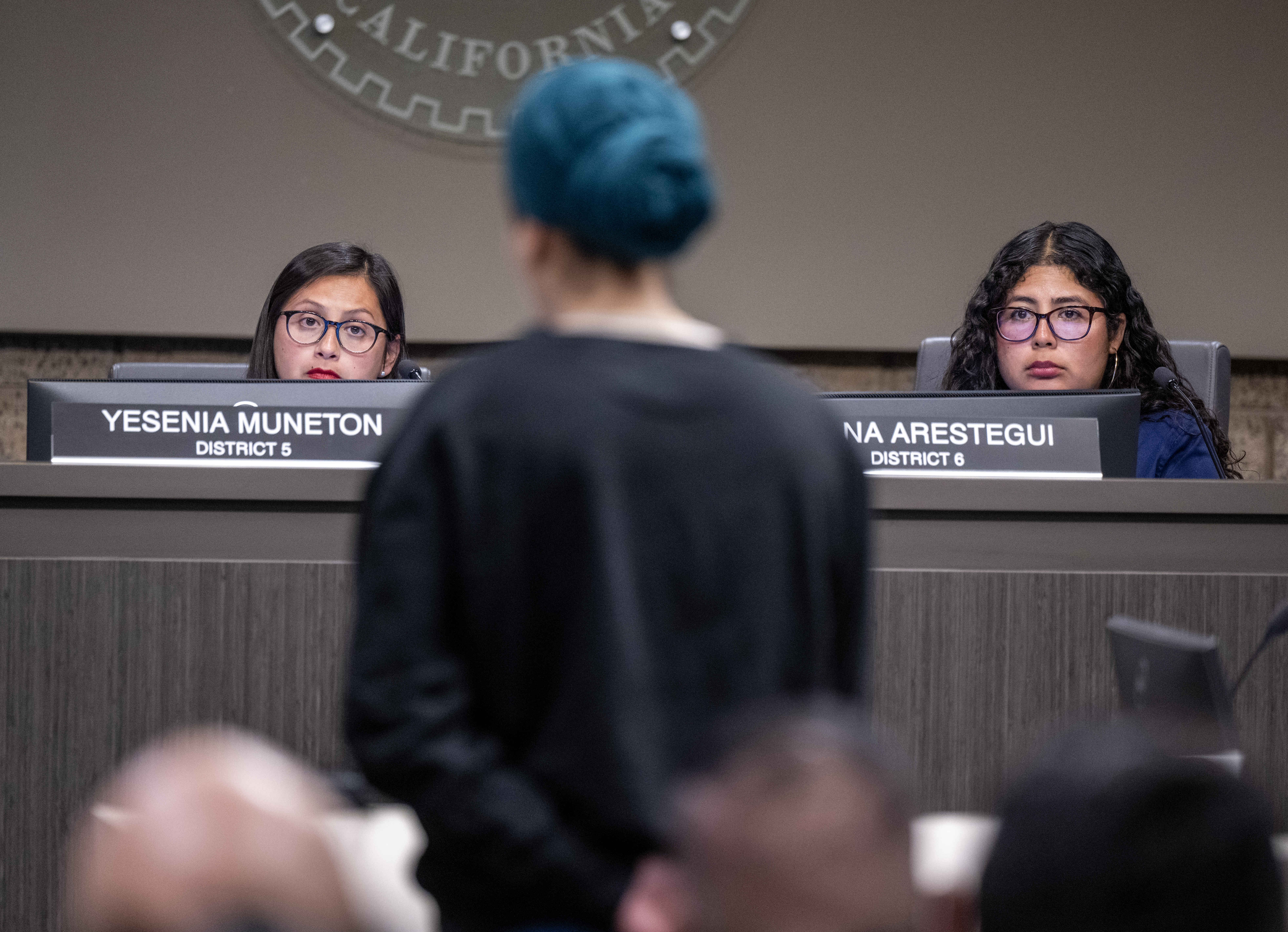 Garden Grove councilmembers Yesenia Muñeton, left, and Ariana Arestegui listen...