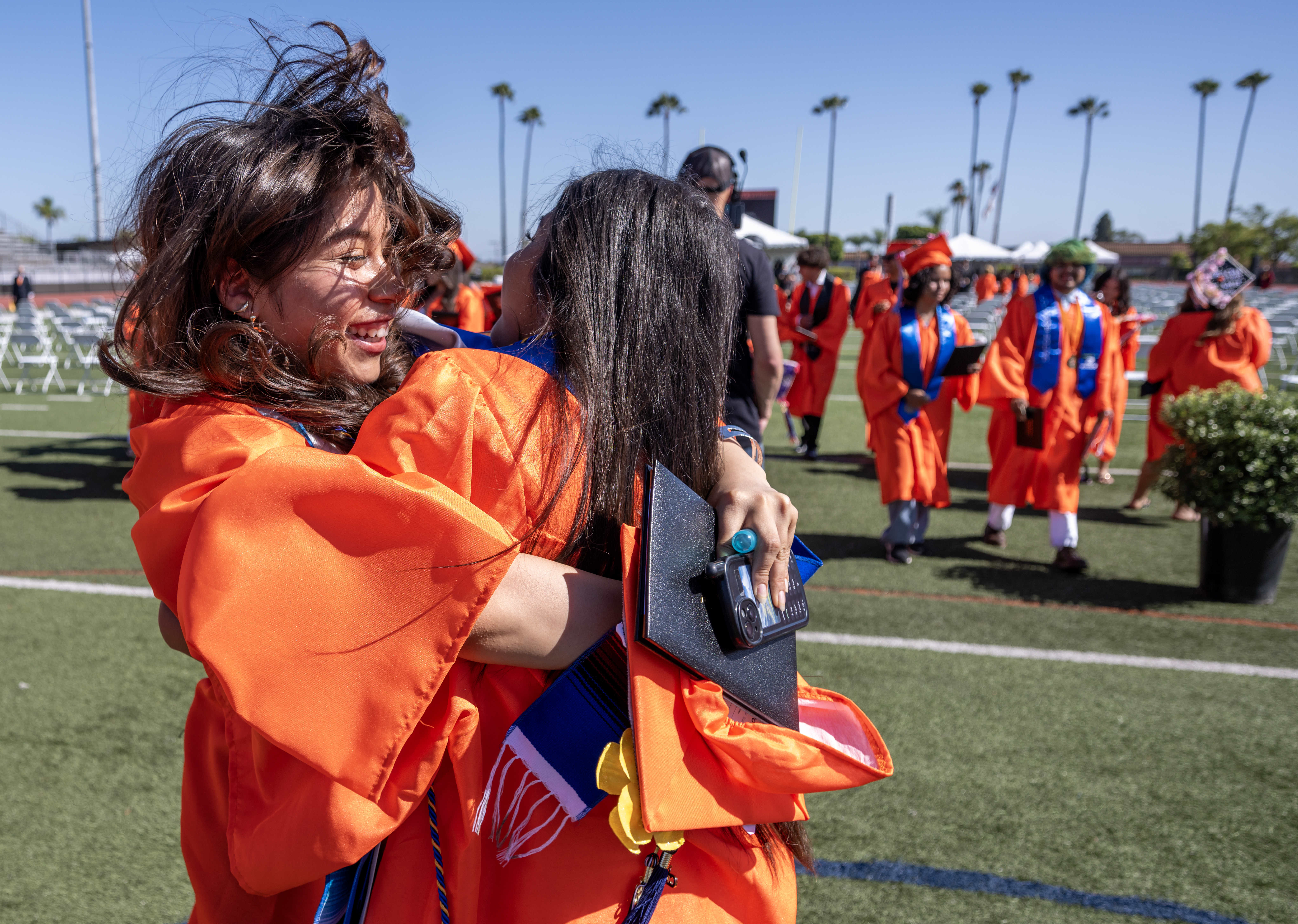 Orange High School graduates celebrate together following their graduation ceremony...