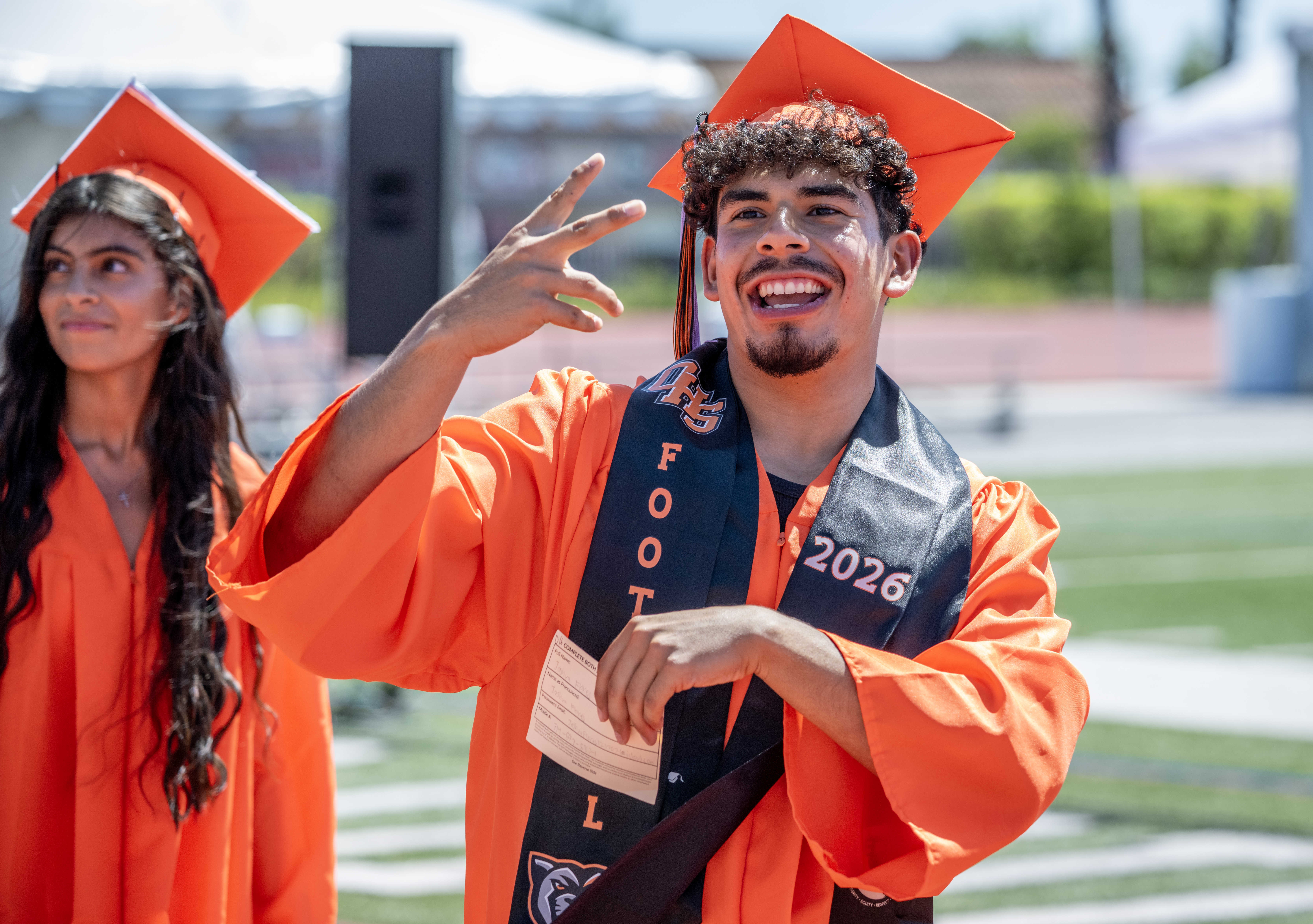 Joshua Flores acknowledges his family in the stands as he...