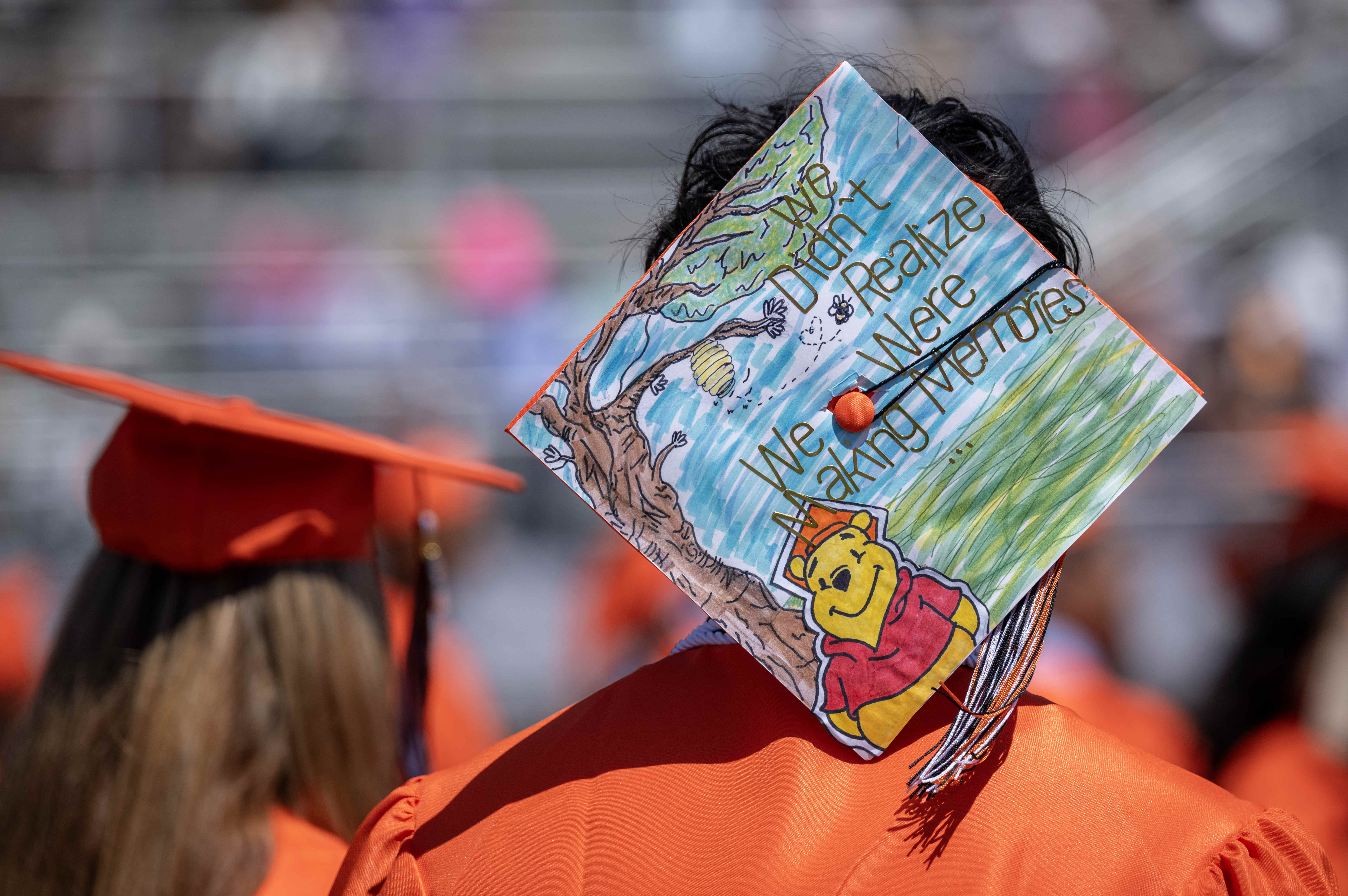 One Orange High School graduate sports a Winnie the Pooh-themed...