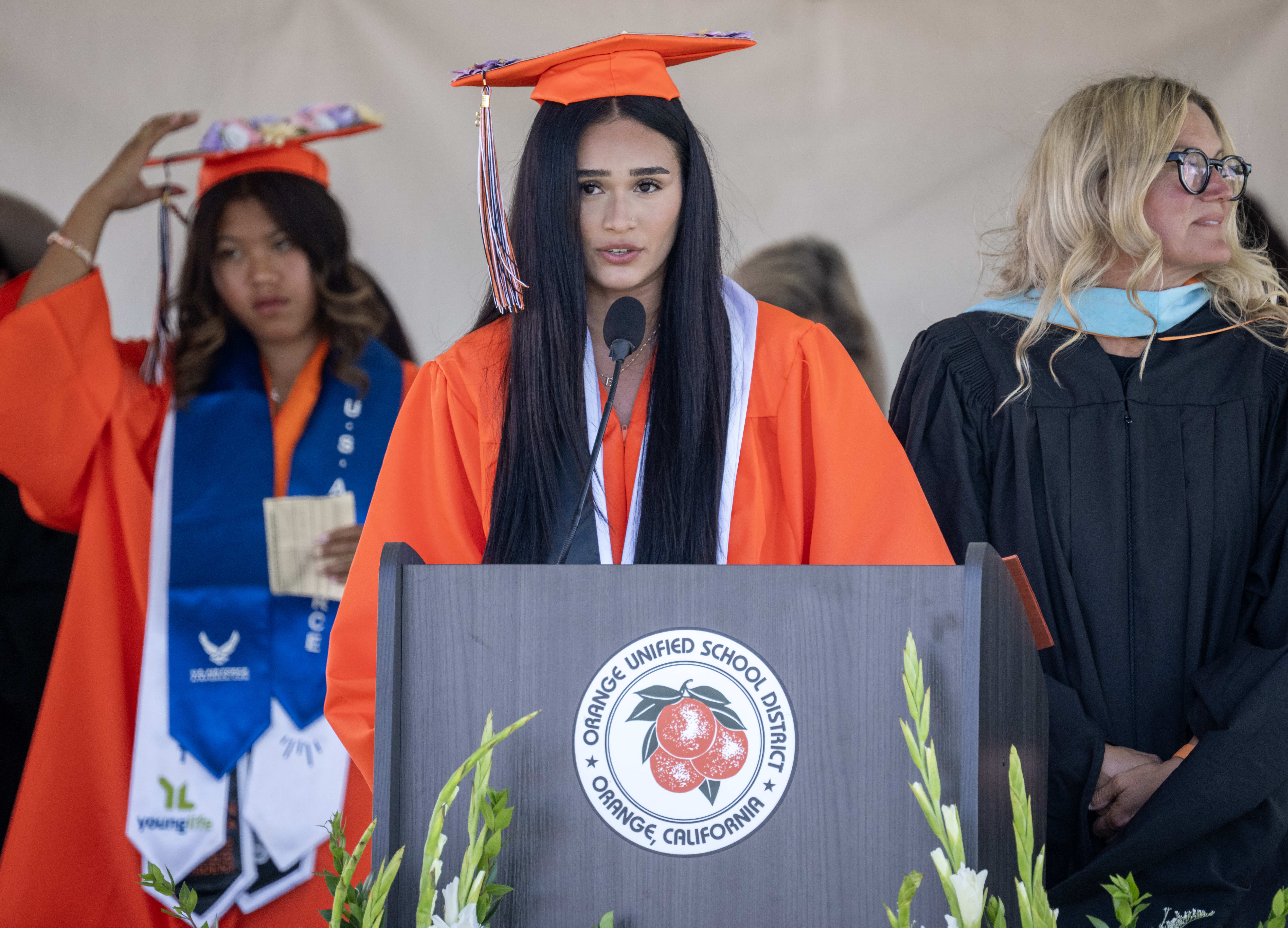ASB President Brenda Alcala Laurean leads a flag salute at...