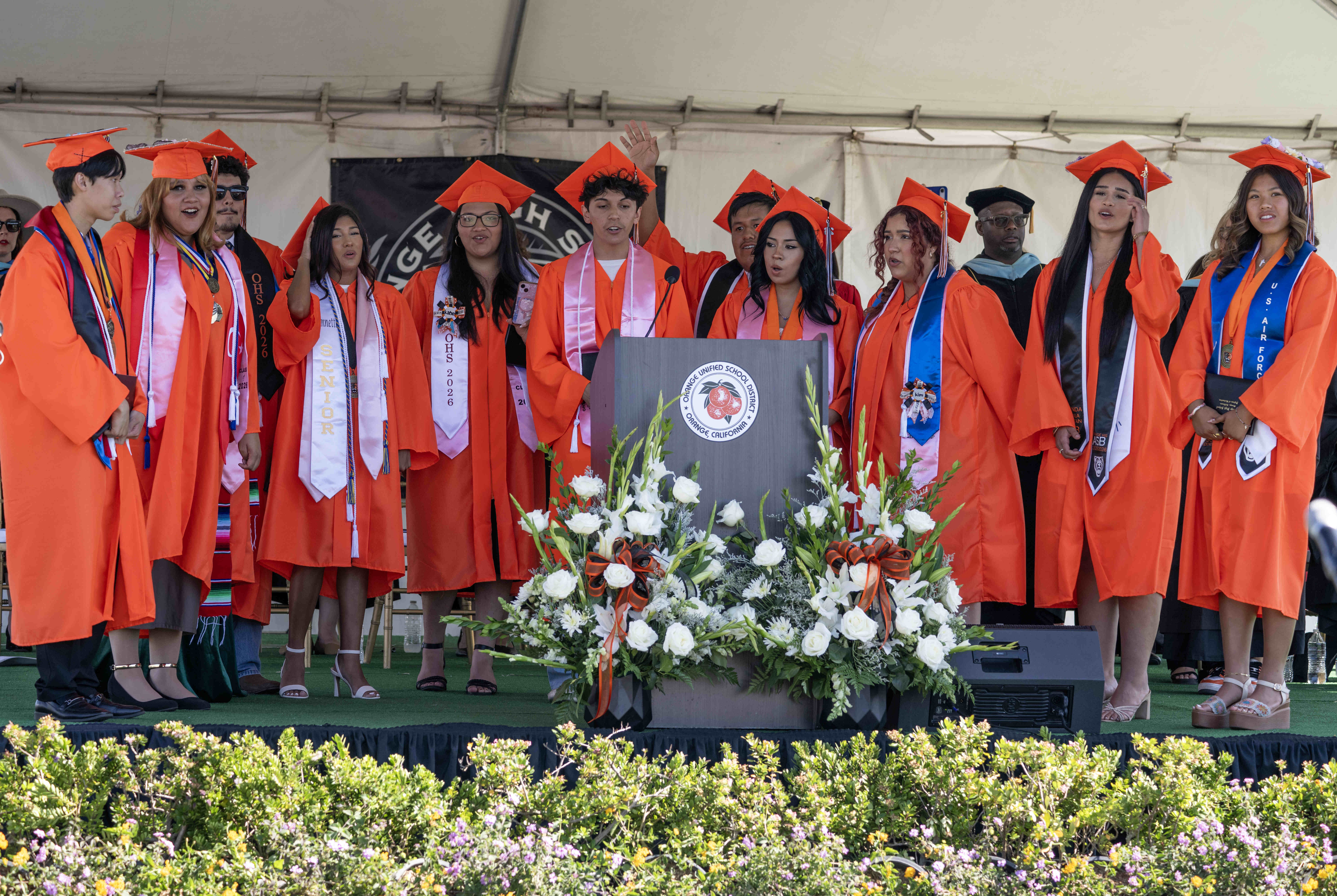 The Orange Chamber Choir Singers perform the schoolâs alma mater...