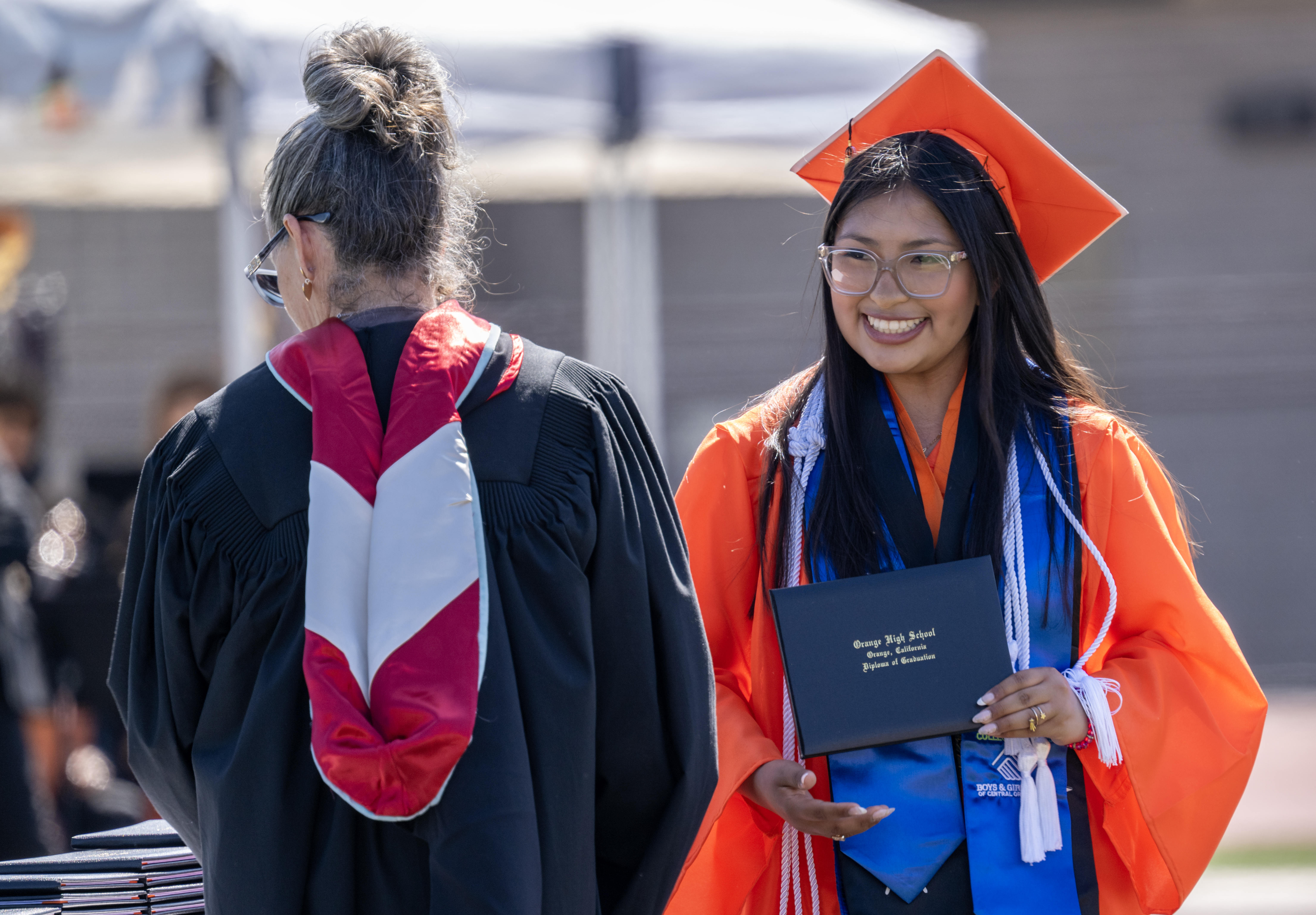 Anabel Delgado accepts her diploma during Orange High Schoolâs graduation...