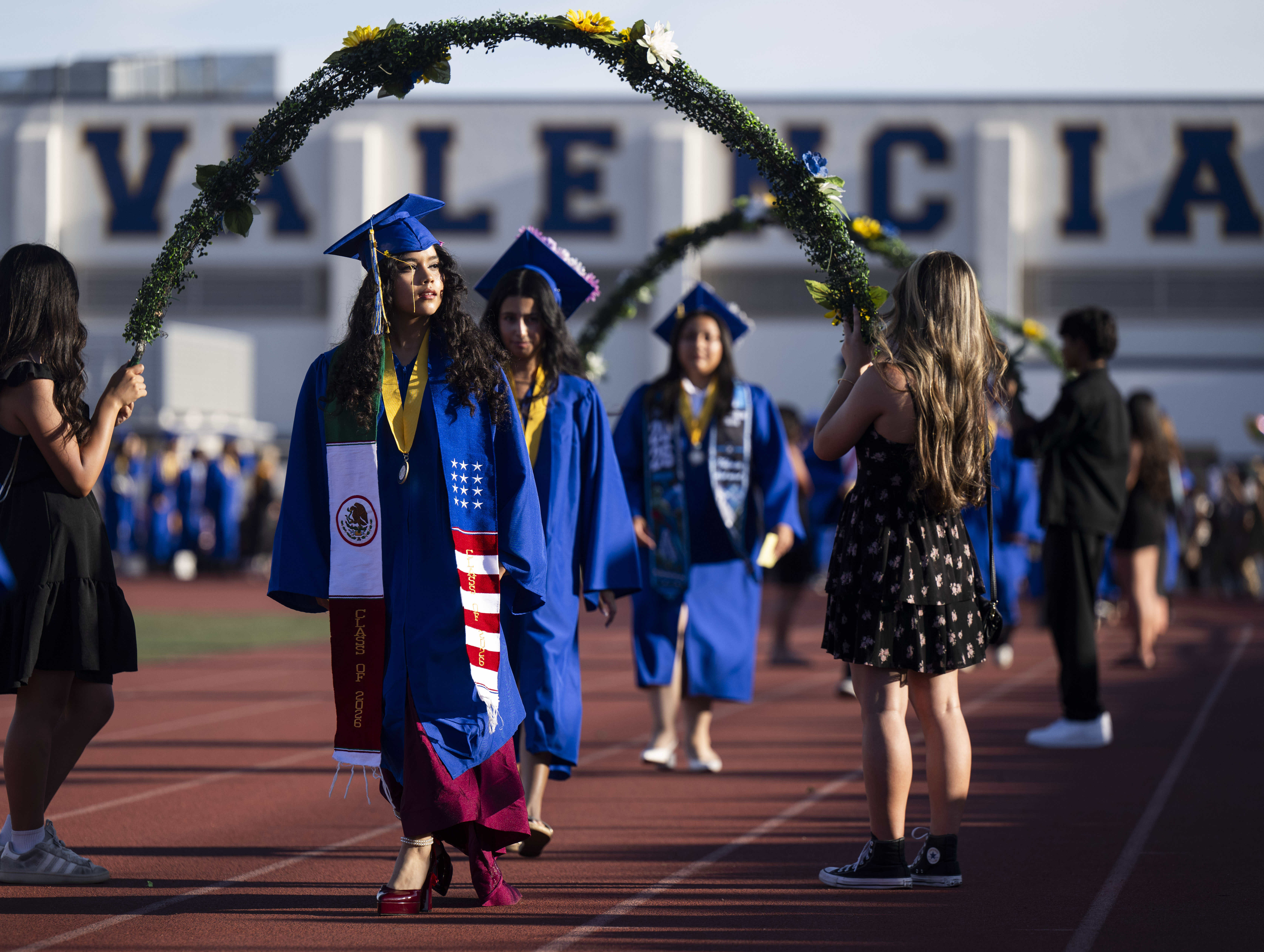 Graduates enter Bradford Stadium for the Valencia High School graduation...