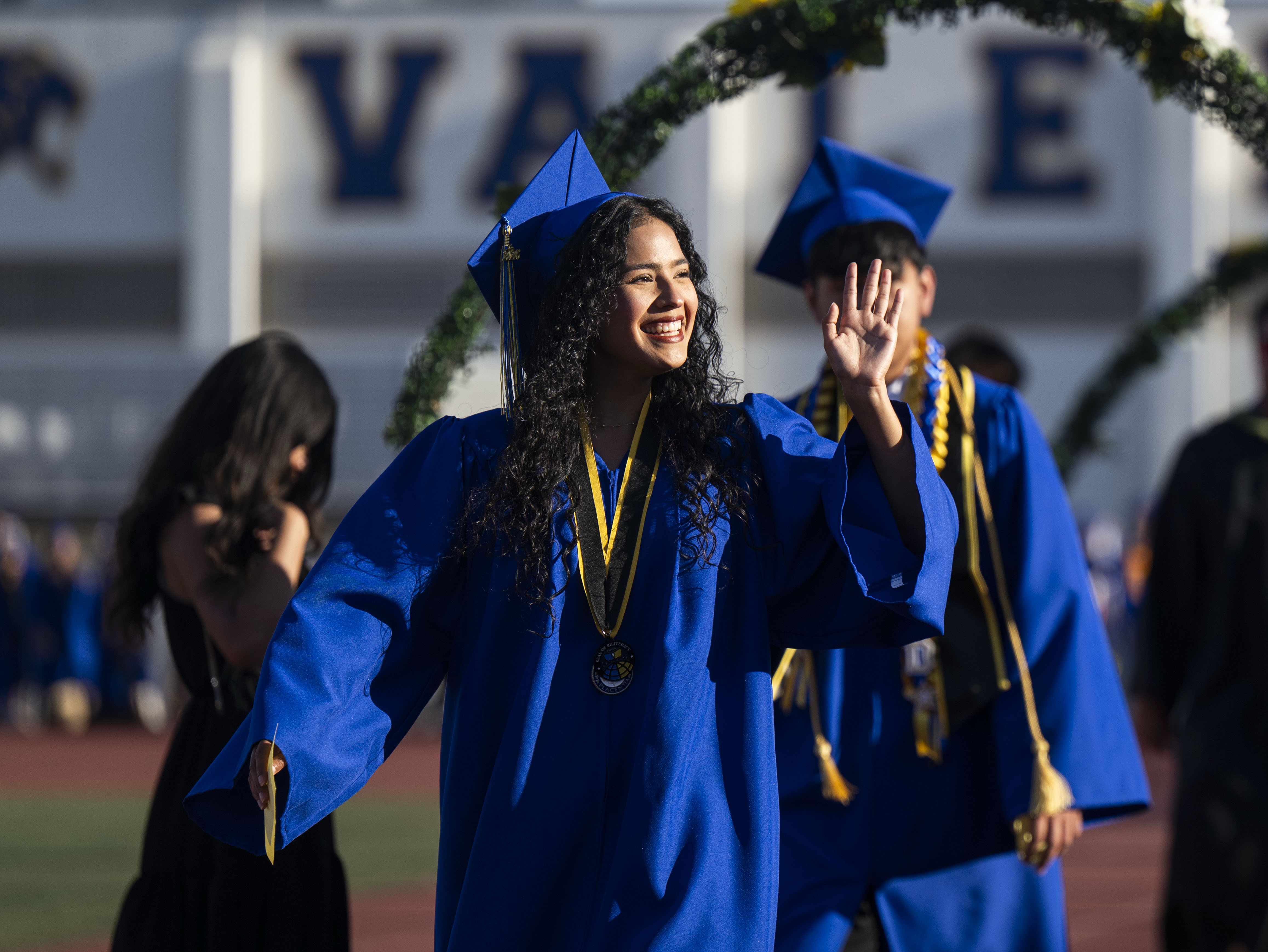 Graduate Jazlyn Cruz enters Bradford Stadium for the Valencia High...