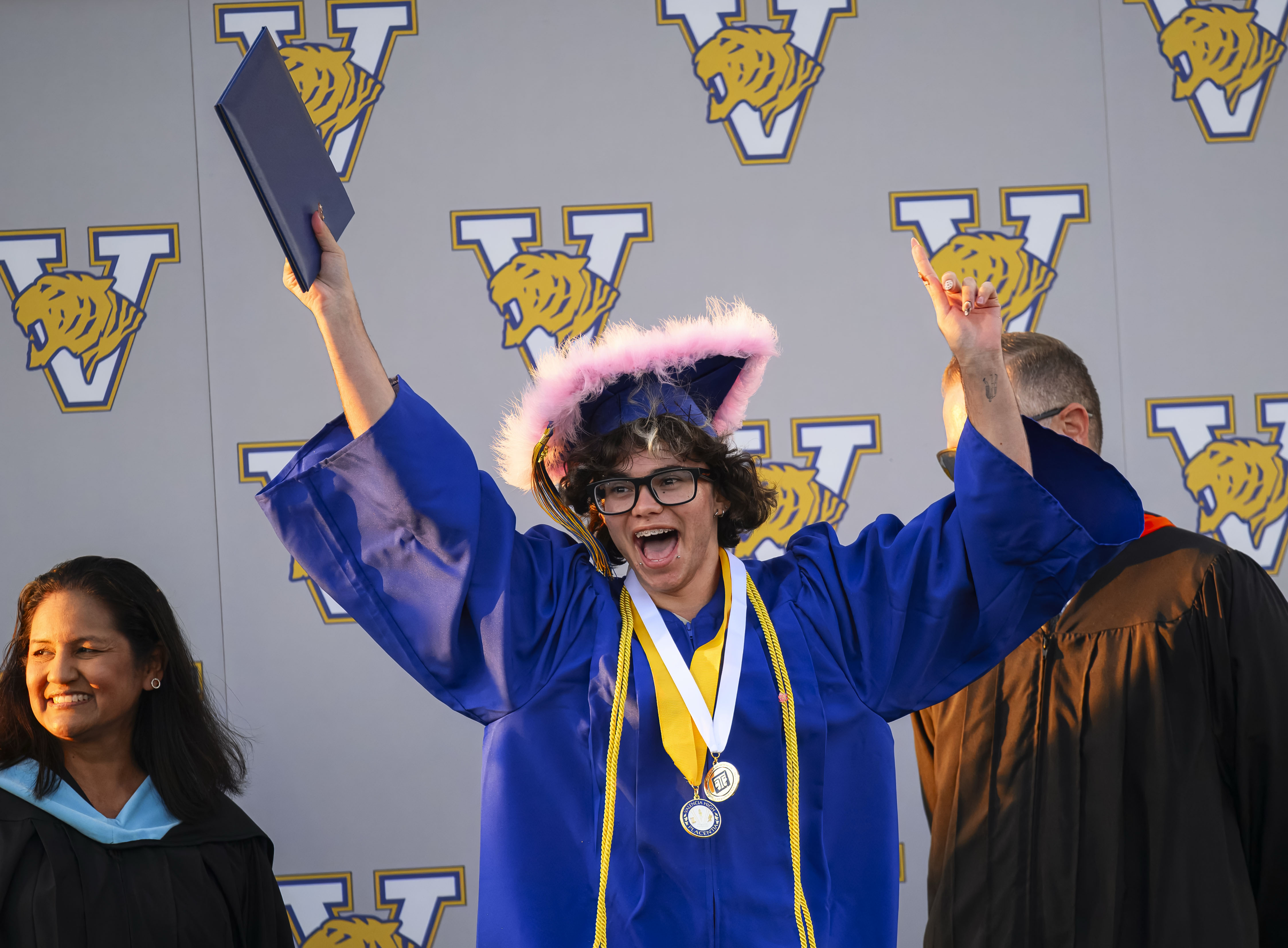 A graduate show his joy after receiving his diploma at...