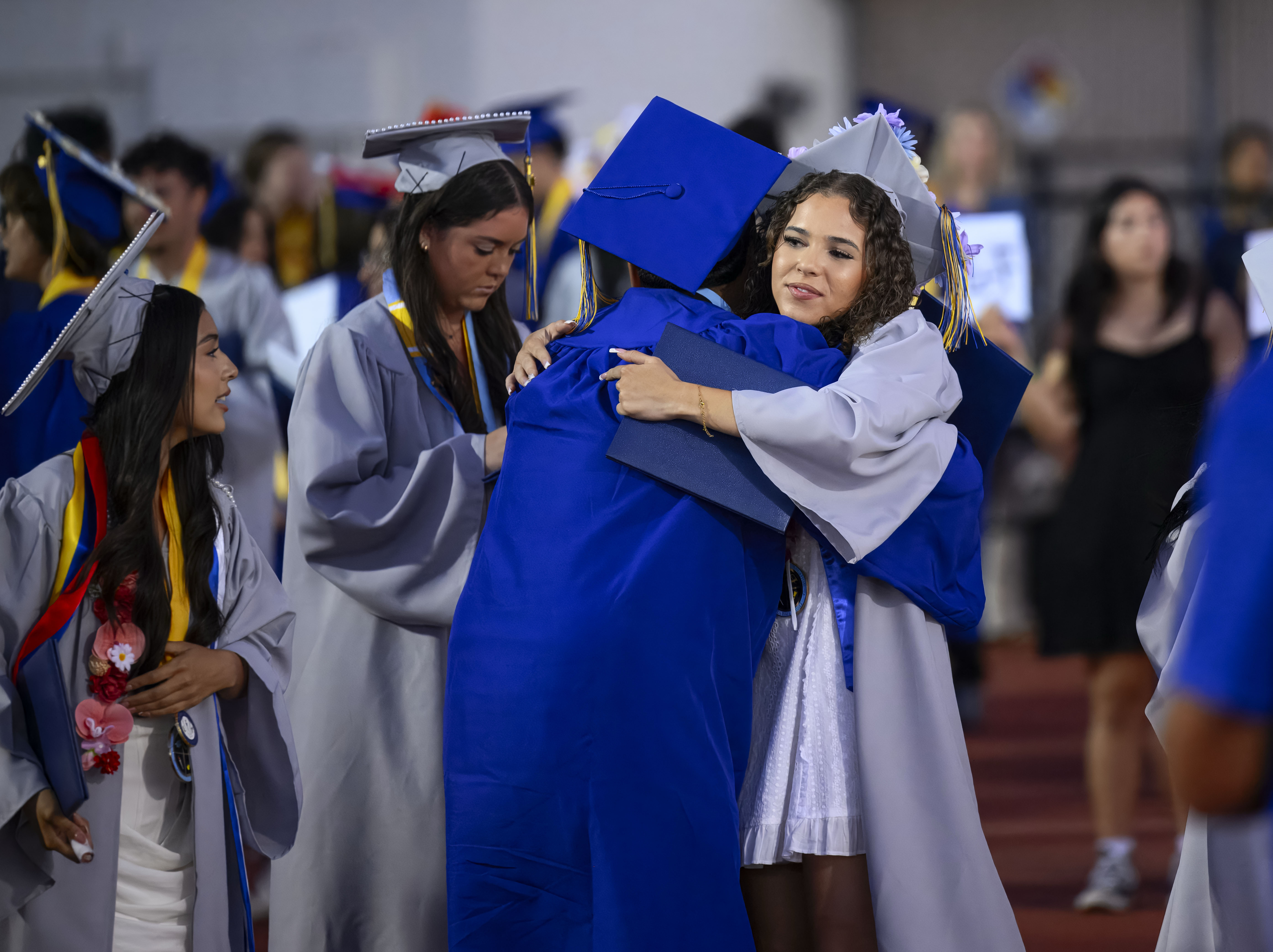 Graduates congratulate each other following the Valencia High School graduation...