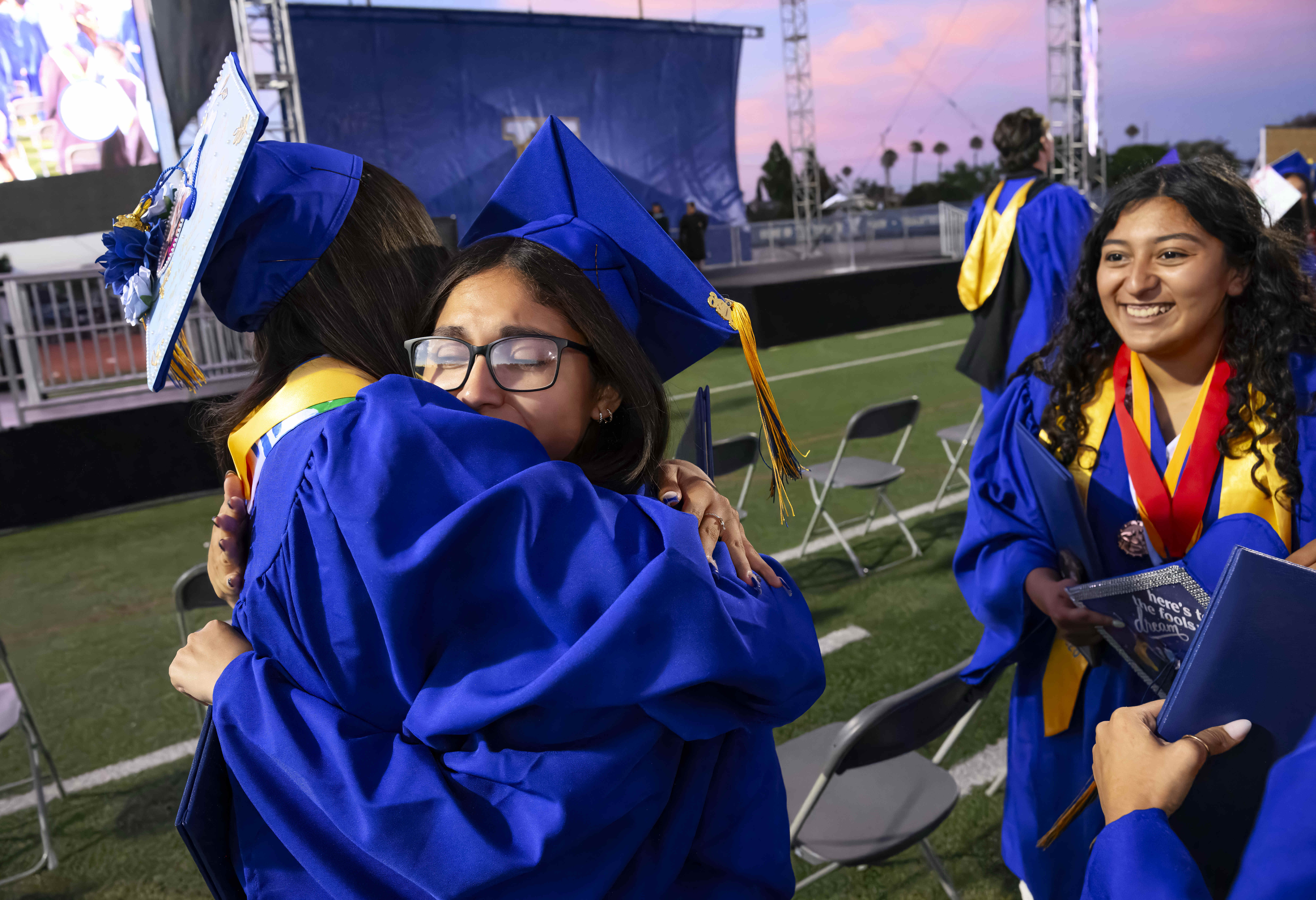 Graduates congratulate each other following the Valencia High School graduation...