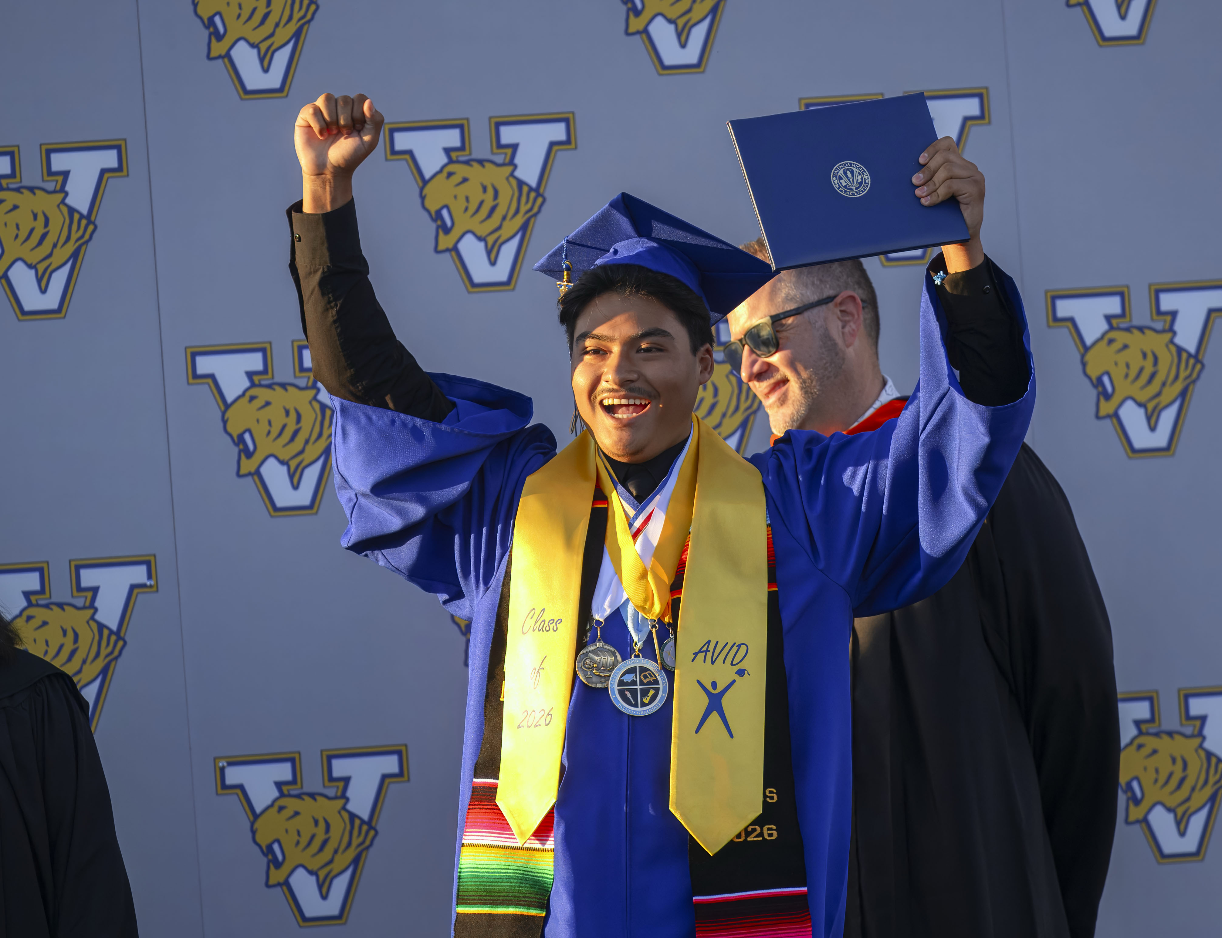 Graduate Jurel Sanchez celebrates after receiving his diploma at the...