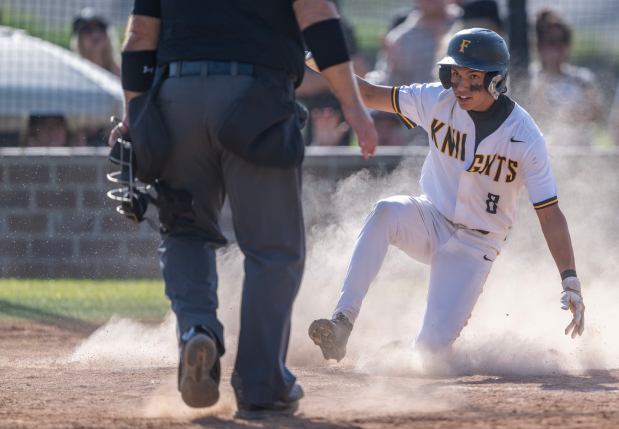 Foothill infielder Jason Gugino slides into home plate to score for the Knights in the bottom of the 5th inning during a CIF-SS Division 2 second round playoff game against Servite in Santa Ana on Tuesday, May 19, 2026. (Photo by Jeff Antenore, Orange County Register/SCNG)