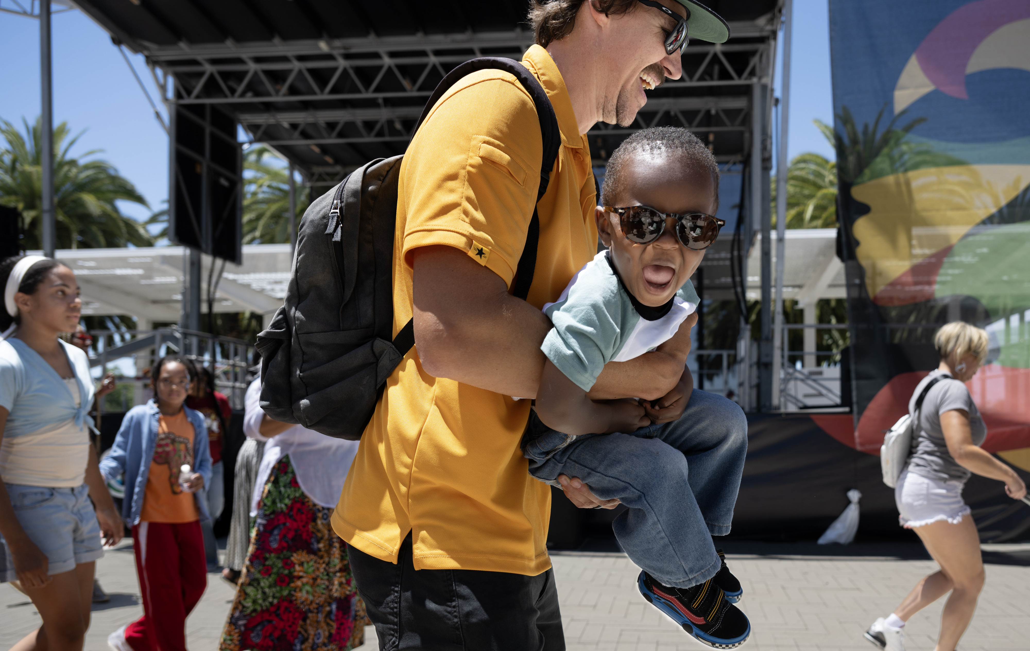 Mark Randel dances with his 2-year-old son, Jaxon, during the...