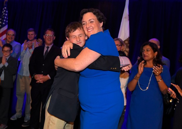 Katie Porter hugs her son Luke after he introduced her to supporters on election night at the Hilton Irvine in Irvine on Nov. 6, 2018. (Photo by Kevin Sullivan, Orange County Register/SCNG)