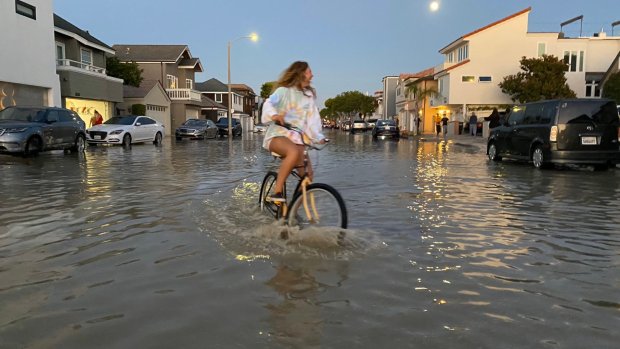 Big waves and a high tide sent ocean water flooding into the streets in Newport Beach late Friday, July 3, 2020 creating a foamy mess on the Balboa Peninsula. (Photo courtesy of @surflick/ Brandon Yamawaki)