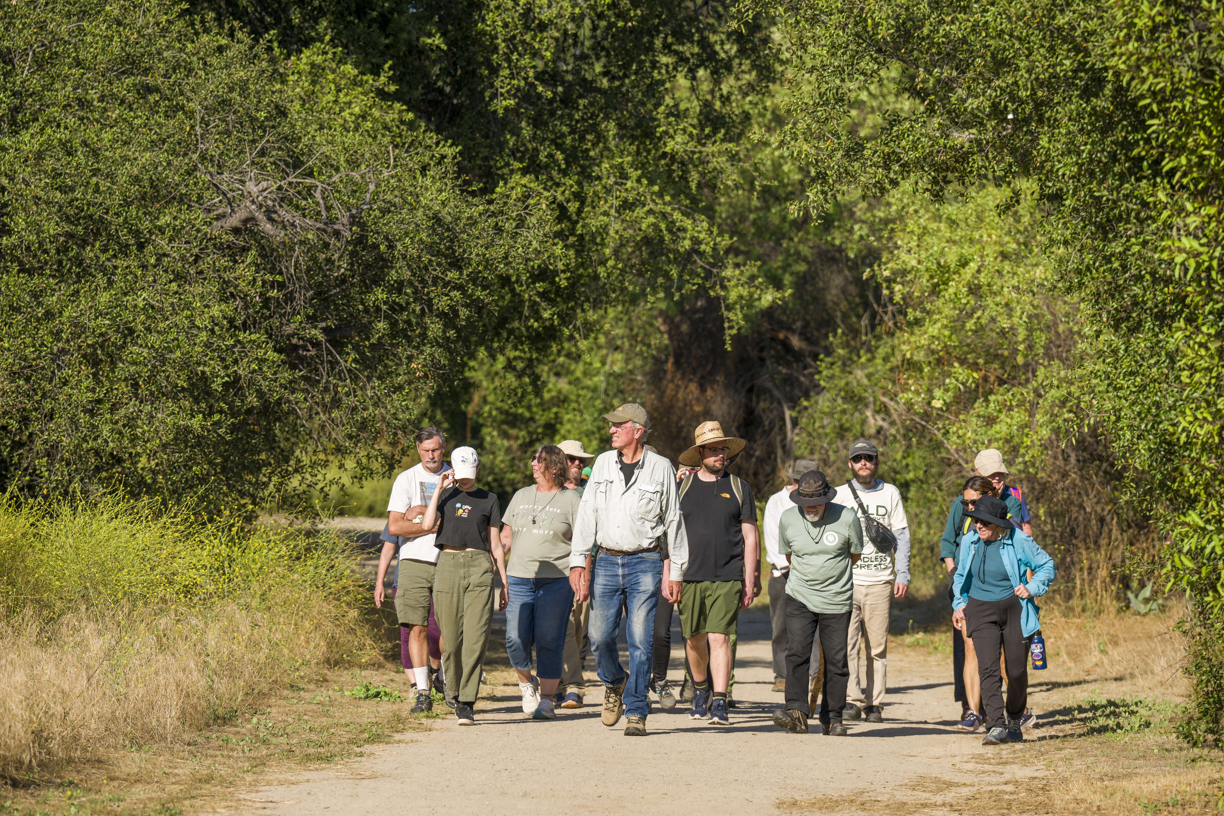 Ron Vanderhoff of the California Native Plant Society, center, leads...