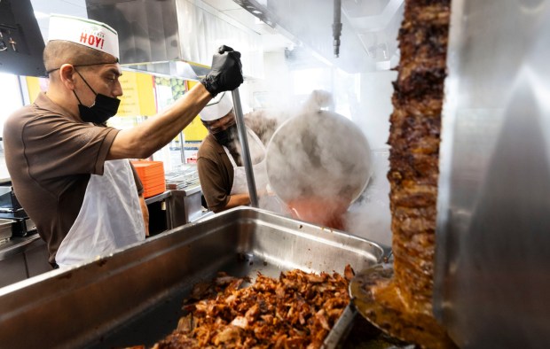 Cooks prepare for the lunch rush at Taqueria Hoy in Orange on Tuesday, May 26, 2026. The restaurant is open 24 hours a day. (Photo by Paul Bersebach, Orange County Register/SCNG)