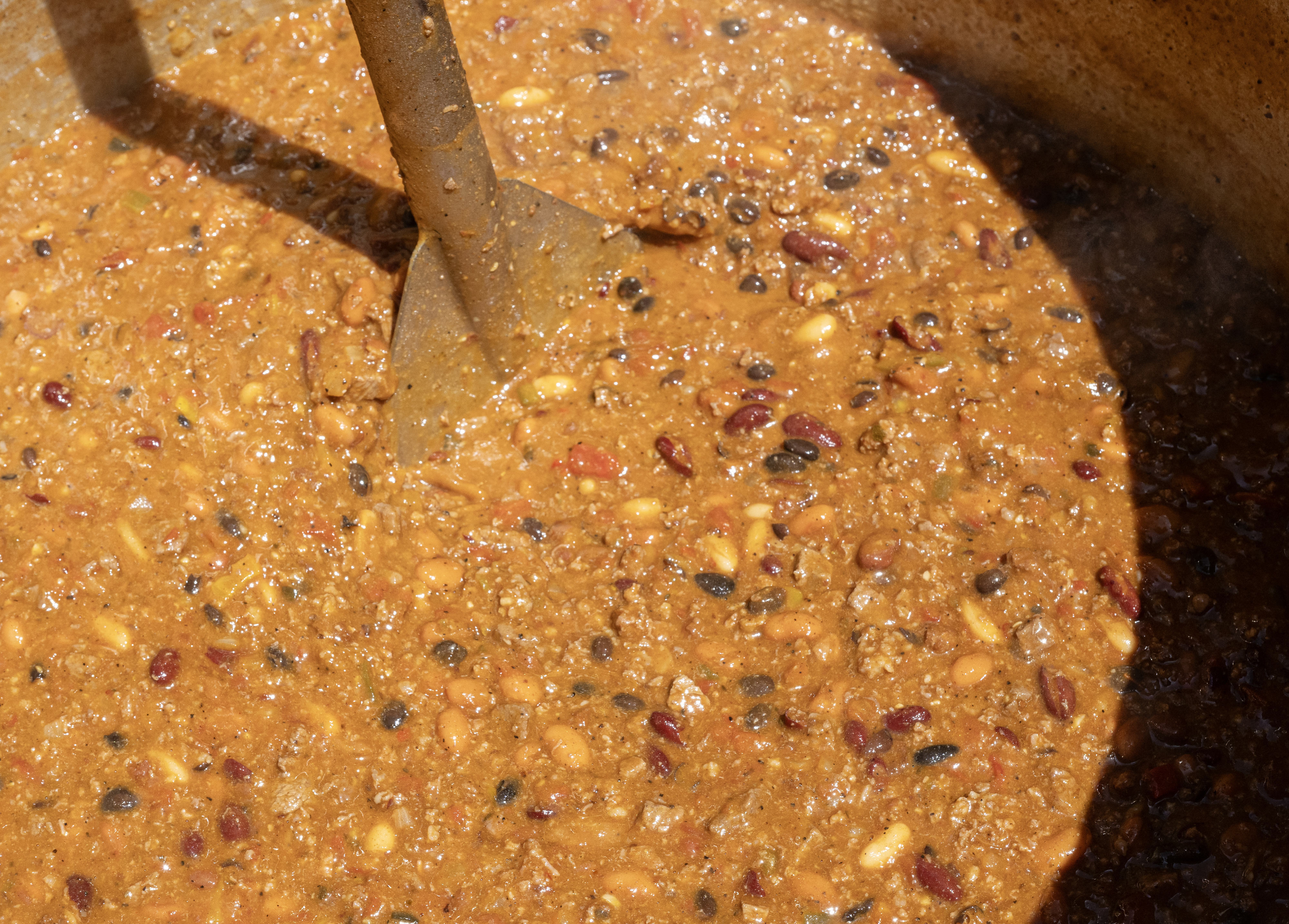 Firefighters with the OCFA stir a vat of chili at...