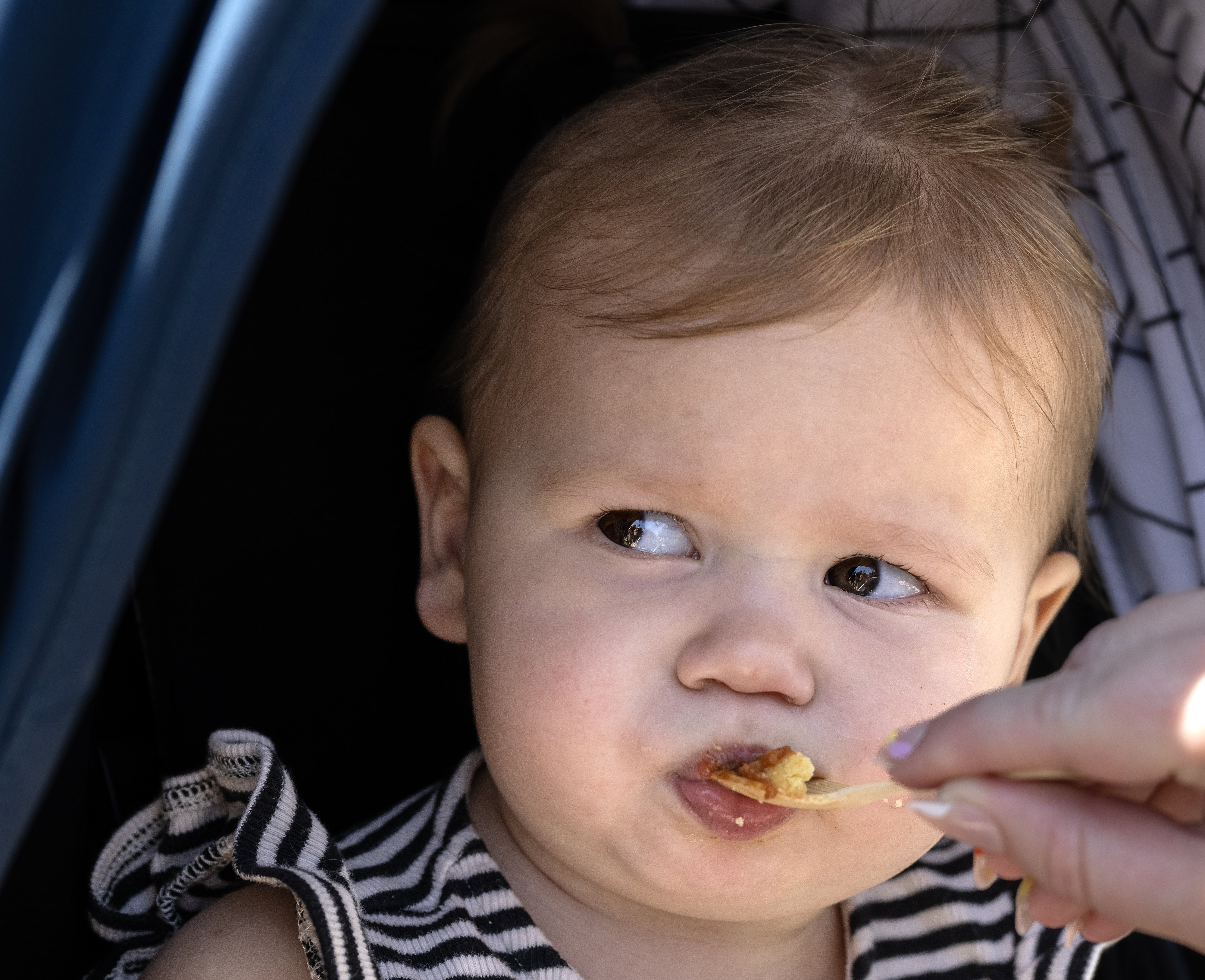 Ellie Herbert, 1, enjoys a spoonful of “Straight Outta Tustin”...