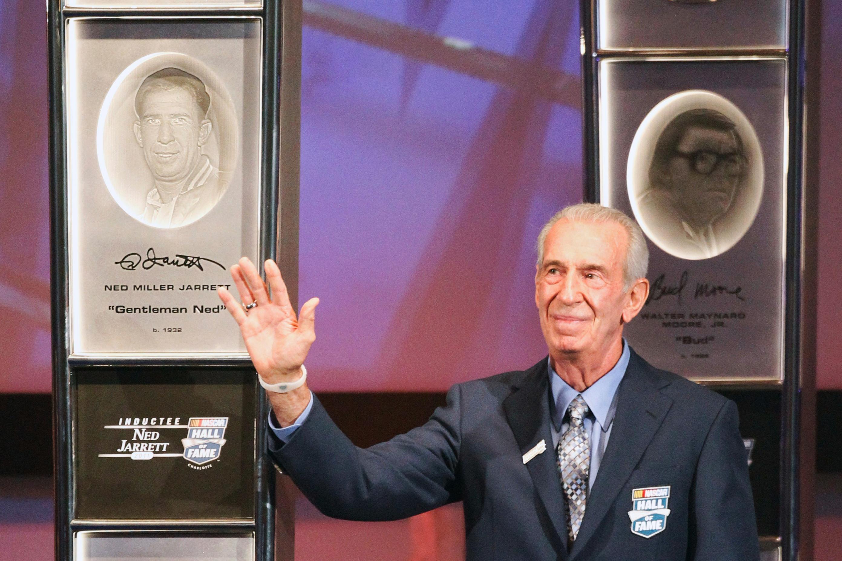 FILE – Ned Jarrett waves to the crowd after being...