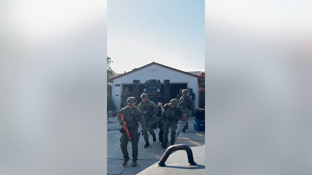 Sheriff's deputies remove Austin Carter, 30, from his home and arrest him