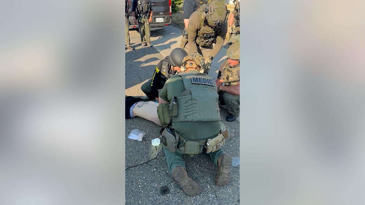 Deputies render aid to Austin Carter after he was apprehended