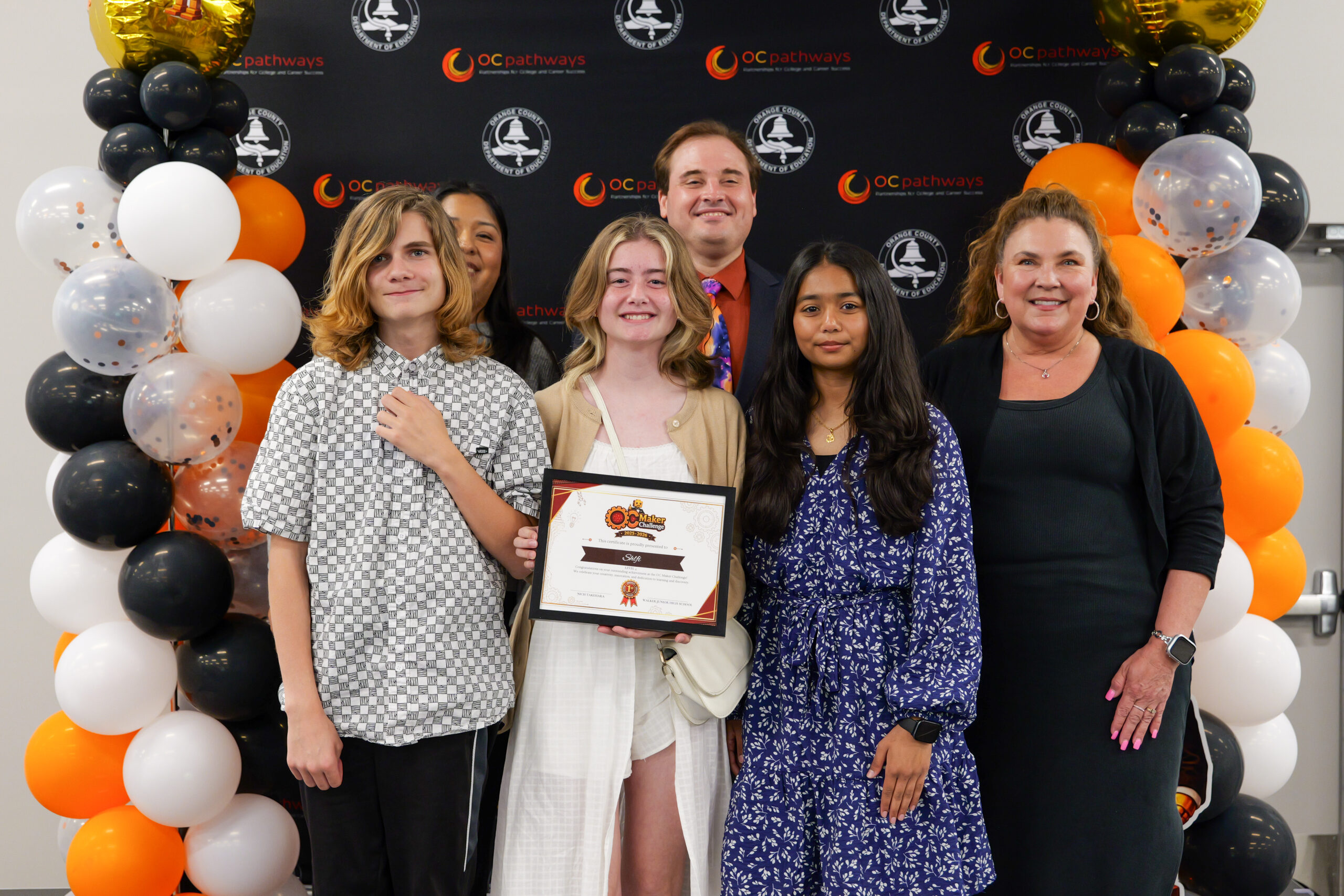 Students Will, Alanna and Kruti from Anaheim's Walker Junior High School receive first place in the app-augmented prototype category for their grade level along with the tooling and fabrication award from Orange County Maker Faire.