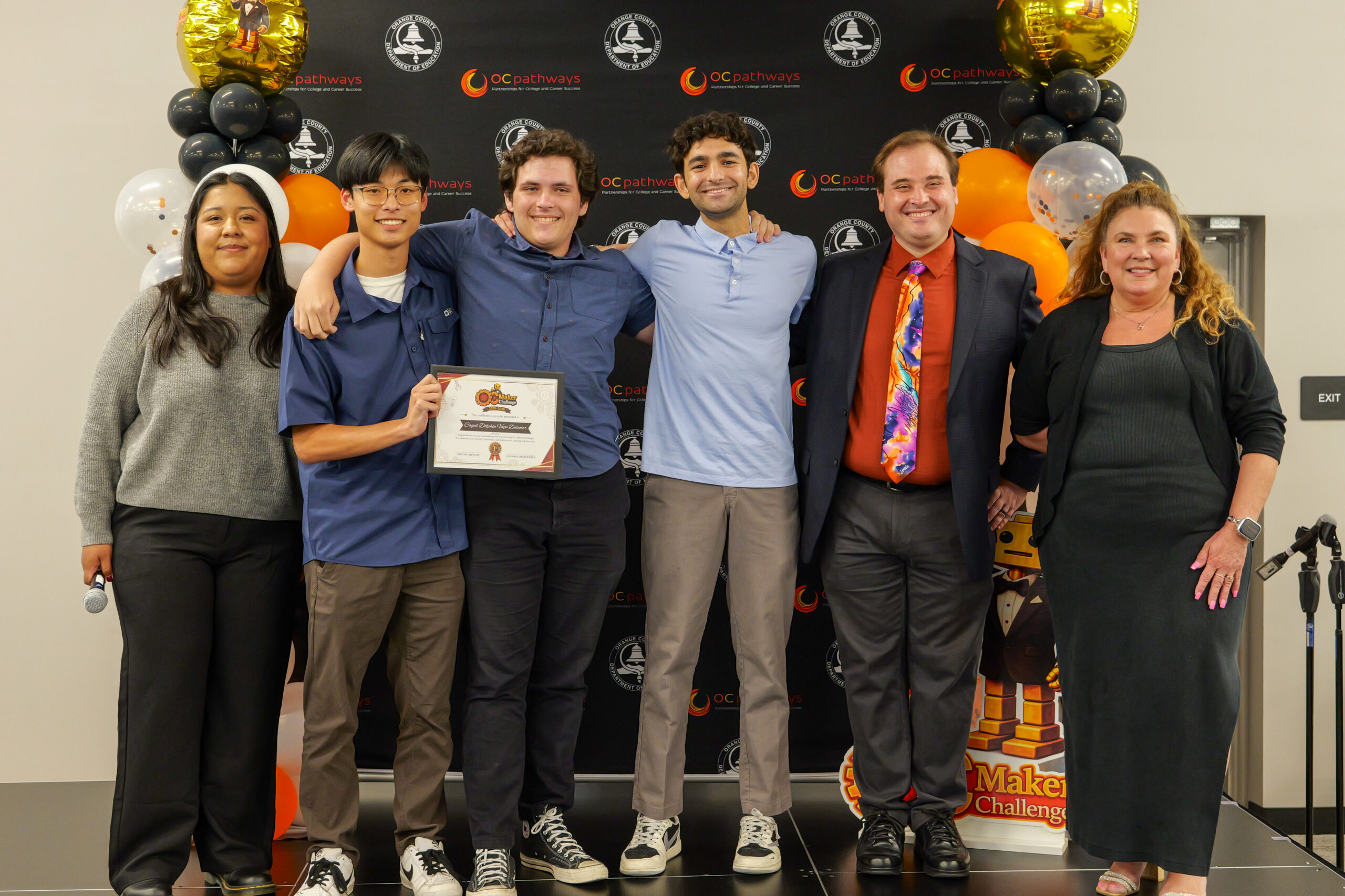 Dana Hills High School students Andre, Nicholas and Brandon win first place for their "Caged Dolphin Vape Detector" project at the annual ocMaker Challenge awards ceremony.