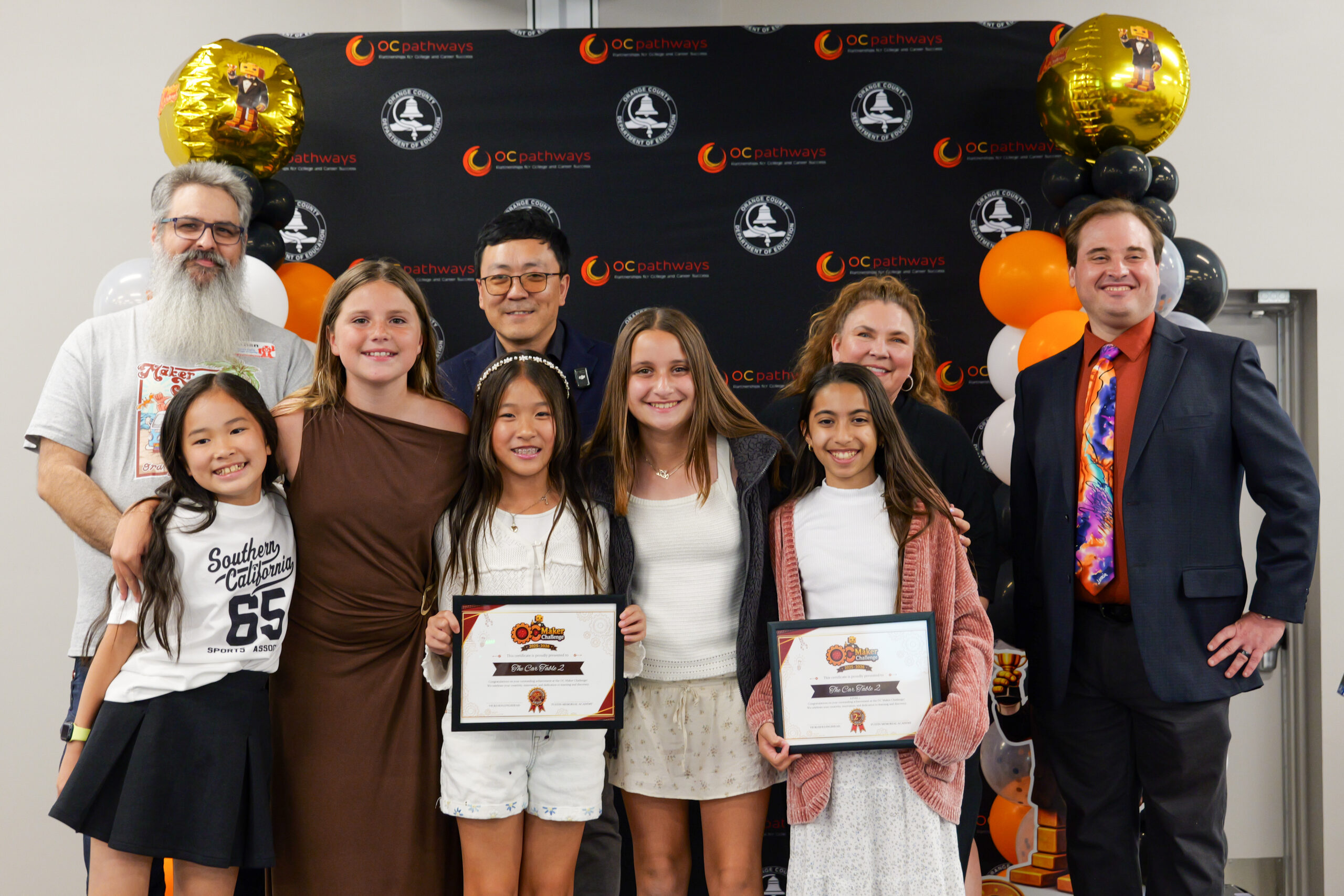 Tustin Memorial Academy students Olivia, Melody K., Ryann, Mitsuki and Melody J. earn second place in the static prototype category for their grade level and a tooling and fabrication award from Orange County Maker Faire at last month's awards ceremony.