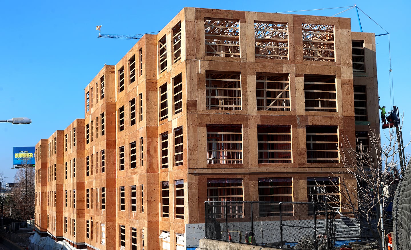 A rare site in Boston these days: Housing construction.