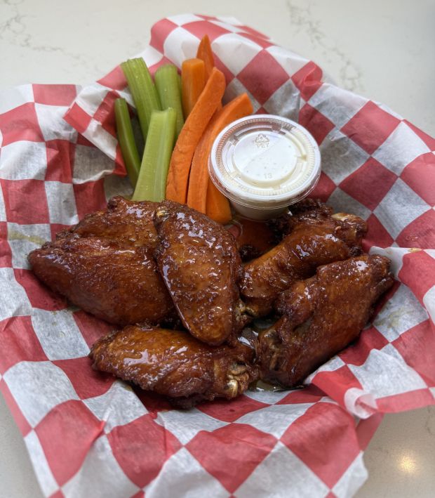 Wings can be ordered in various amounts and with numerous options for sauces, such as these wings seasoned in hot honey sauce. (Courtesy of Seniore's Pizza)
