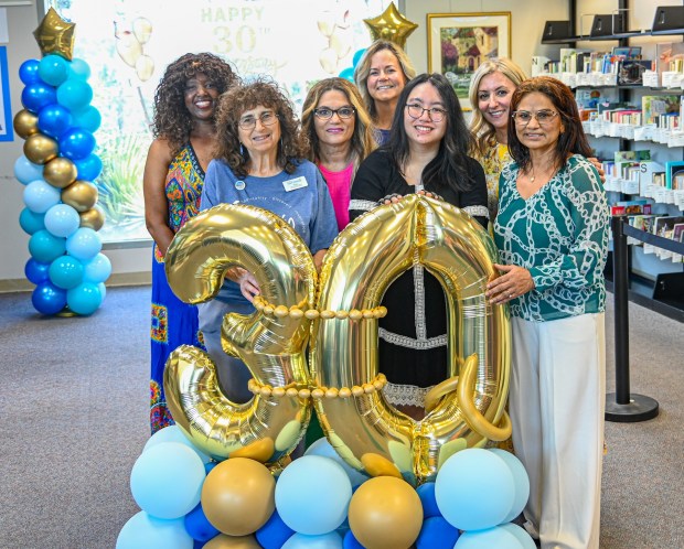 Supervising librarian Robyn Gage-Norquiste, RB children's librarian Helene Idels, RB branch manager Zeina Guoin, SDPL director Misty Jones, library assistant Quynh Giang and librarians Minoo Hadidi and Reba Paul. (Criselda Yee)