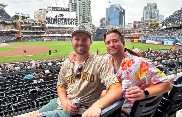 Padres fans Cameron Pado and Charlie Hopper offered their take on the team's offensive woes. (Kirk Kenney / San Diego Union-Tribune)