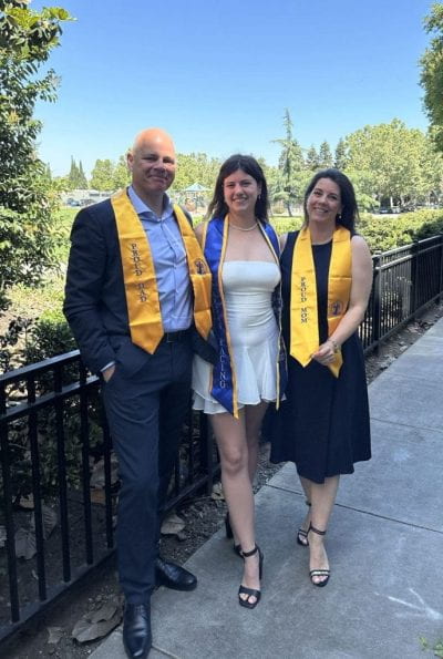 Robine van Veen with her parents after surprising them with “Proud Mom/Dad” stoles right before Commencement. Photo courtesy of Robine van Veen.