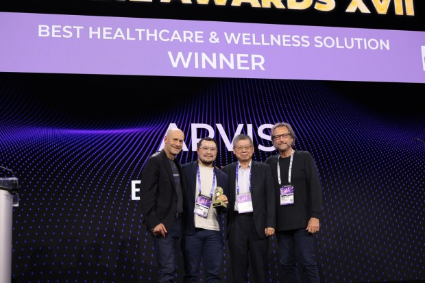Enovis executives stood on stage to accept the award for Best Healthcare & Wellness Solution. (AWE)
