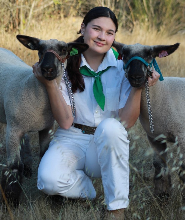 Ramona resident Angel Garrett, shown with her lambs Astro, left, and Apollo, received a $3,500 Junior Livestock Auction Scholarship and a $1,500 Roxana Foxx Endowment FFA Scholarship. Garrett plans to study animal science at the University of Idaho. (Courtesy Angel Garrett)