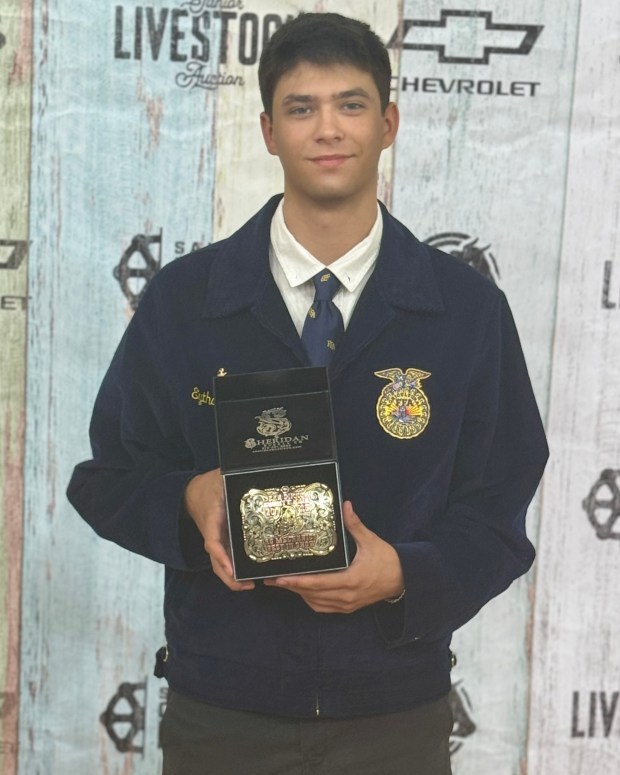 Ramona resident Eythan Browning holds a belt buckle that he won for his 14-foot dump trailer project on display at the San Diego County Fair. Browning received a $2,500 Allan Royster Endowment Vocational Education Scholarship to study welding at ABC Construction. (Courtesy Eythan Browning)