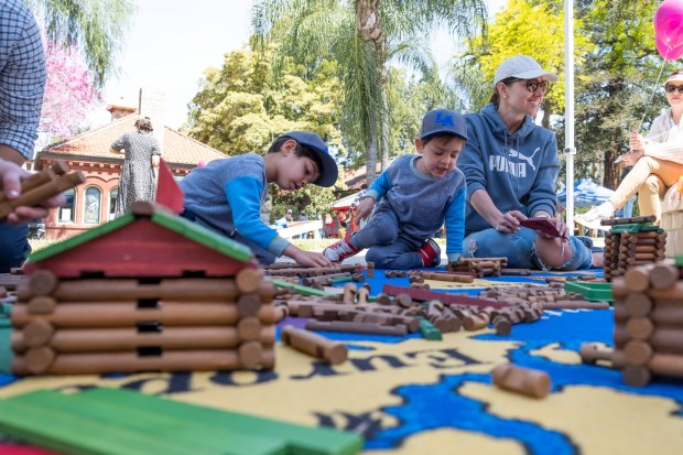 The Lincoln Memorial Shrine provided Lincoln Logs for children on Library Day at Smiley Park in Redlands in May 2023. (Photo by Angel Pena, Contributing Photographer) 