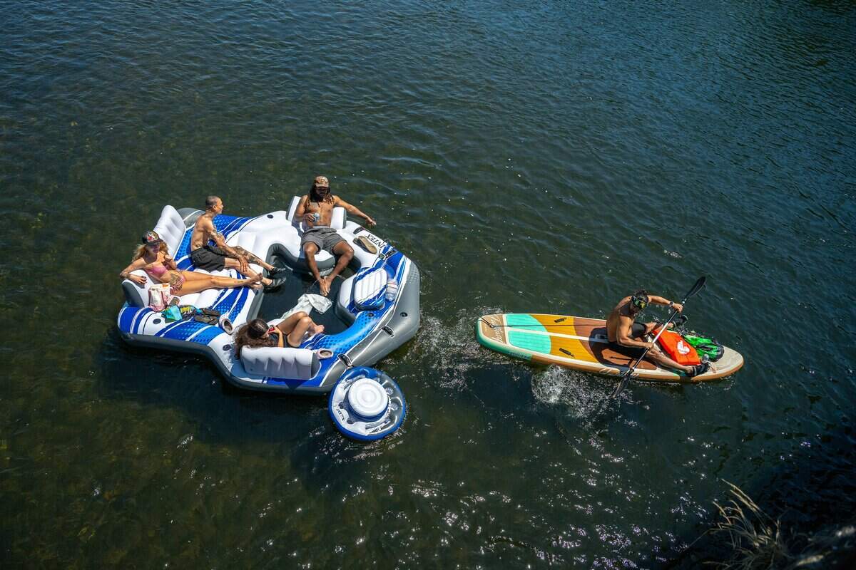 Visitors enjoy a variety of water sports on the American River in the Sunrise Recreation Area on Memorial Day, Monday, May 25, 2026, in Rancho Cordova. Cooler, windy weather brought out fewer families to the river.