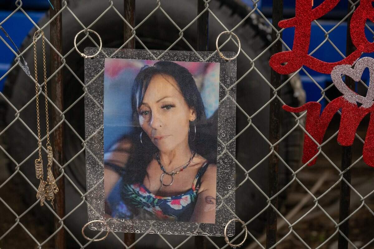 A photograph of Wendy Connell hangs on Feb. 6, 2025, on a memorial for her at the intersection of Roseville Road and Longview Drive, where she was fatally hit by a truck while cycling to a dentist appointment.