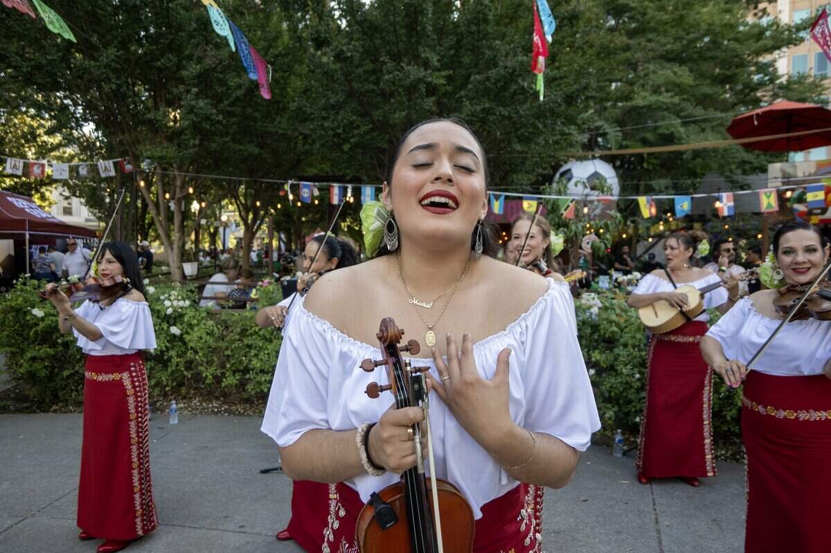 Marivi Salas performs with the Sacramento-based Mariachi Bonitas during Sacramento Republic FC's World Cup block party on Wednesday, June 24, 2026, at the park across from City Hall in downtown Sacramento.